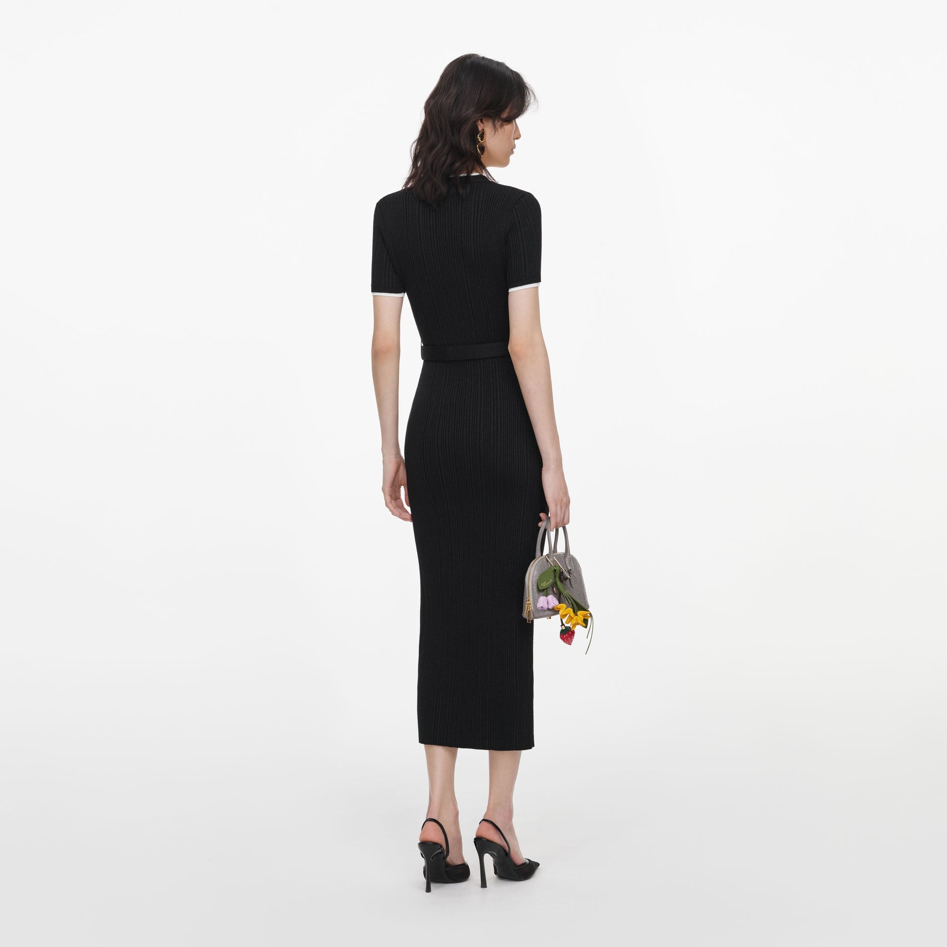 Back view of a woman wearing the Black Rib Knit Midi Dress