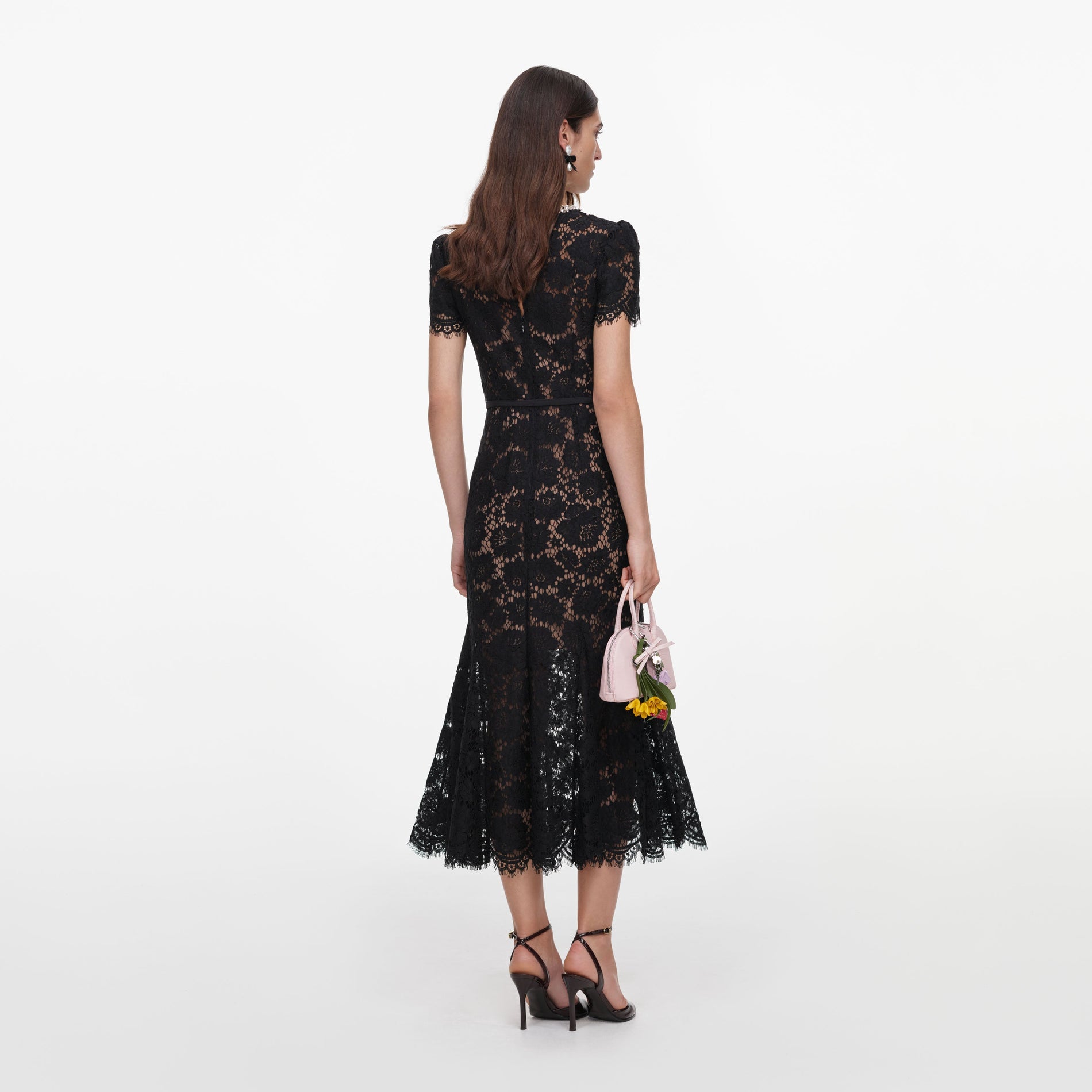 Back view of a woman wearing the Black Sequin Lace Midi Dress