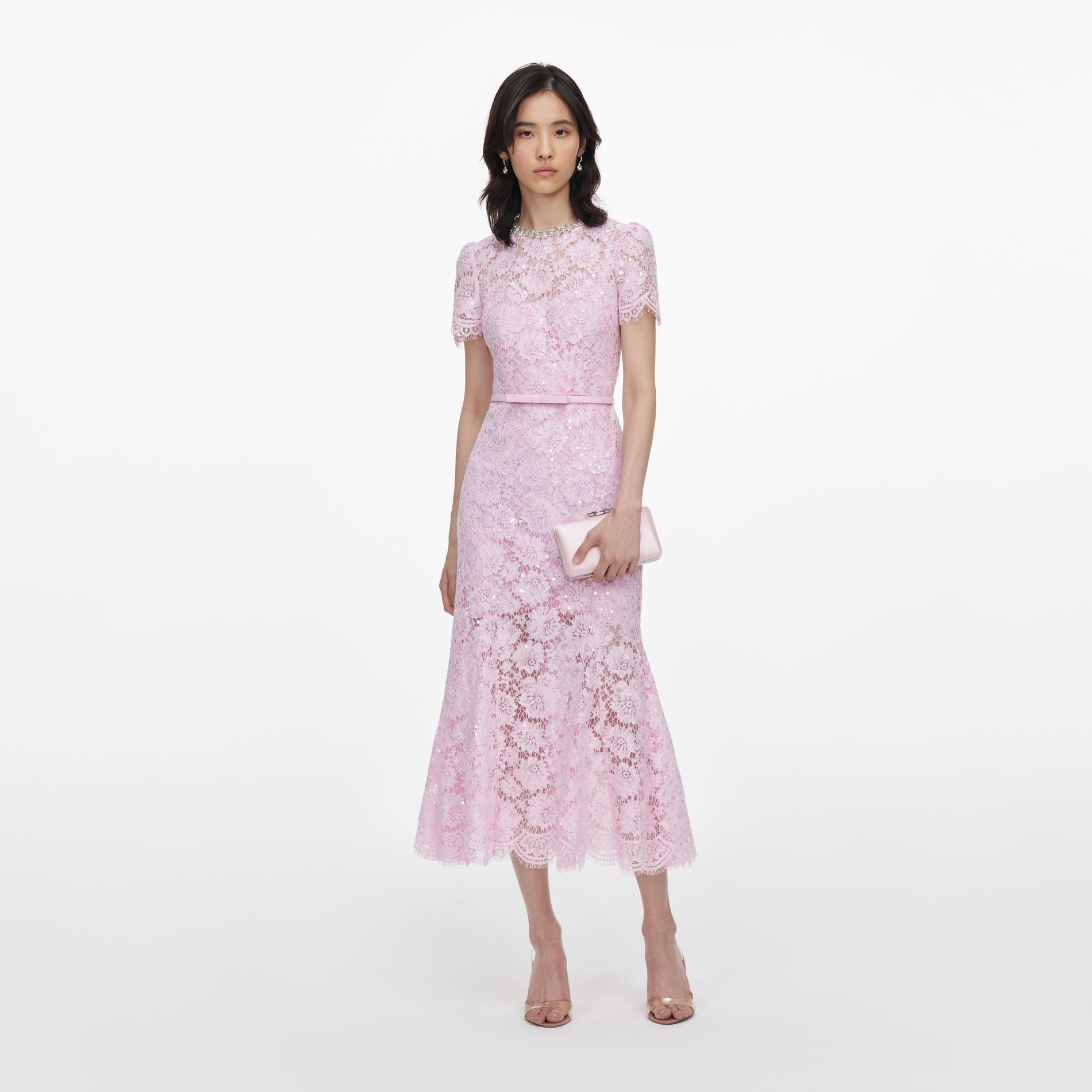 Front view of a woman wearing the Pink Sequin Lace Midi Dress