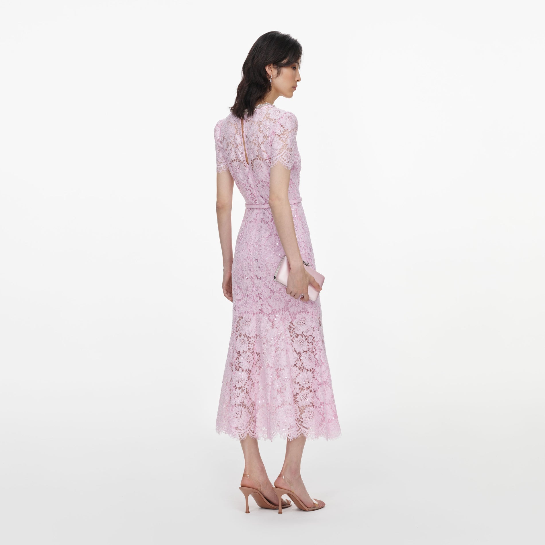 Back view of a woman wearing the Pink Sequin Lace Midi Dress