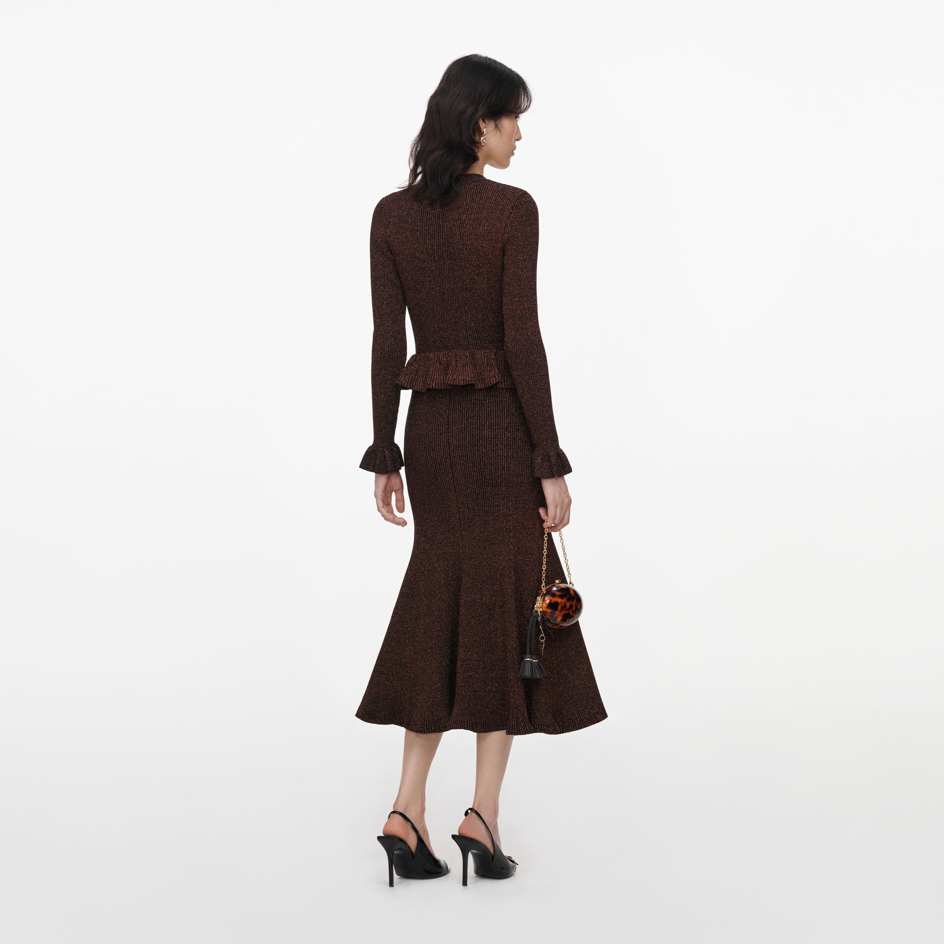 Back view of a woman wearing the Brown Lurex Peplum Knit Midi Dress
