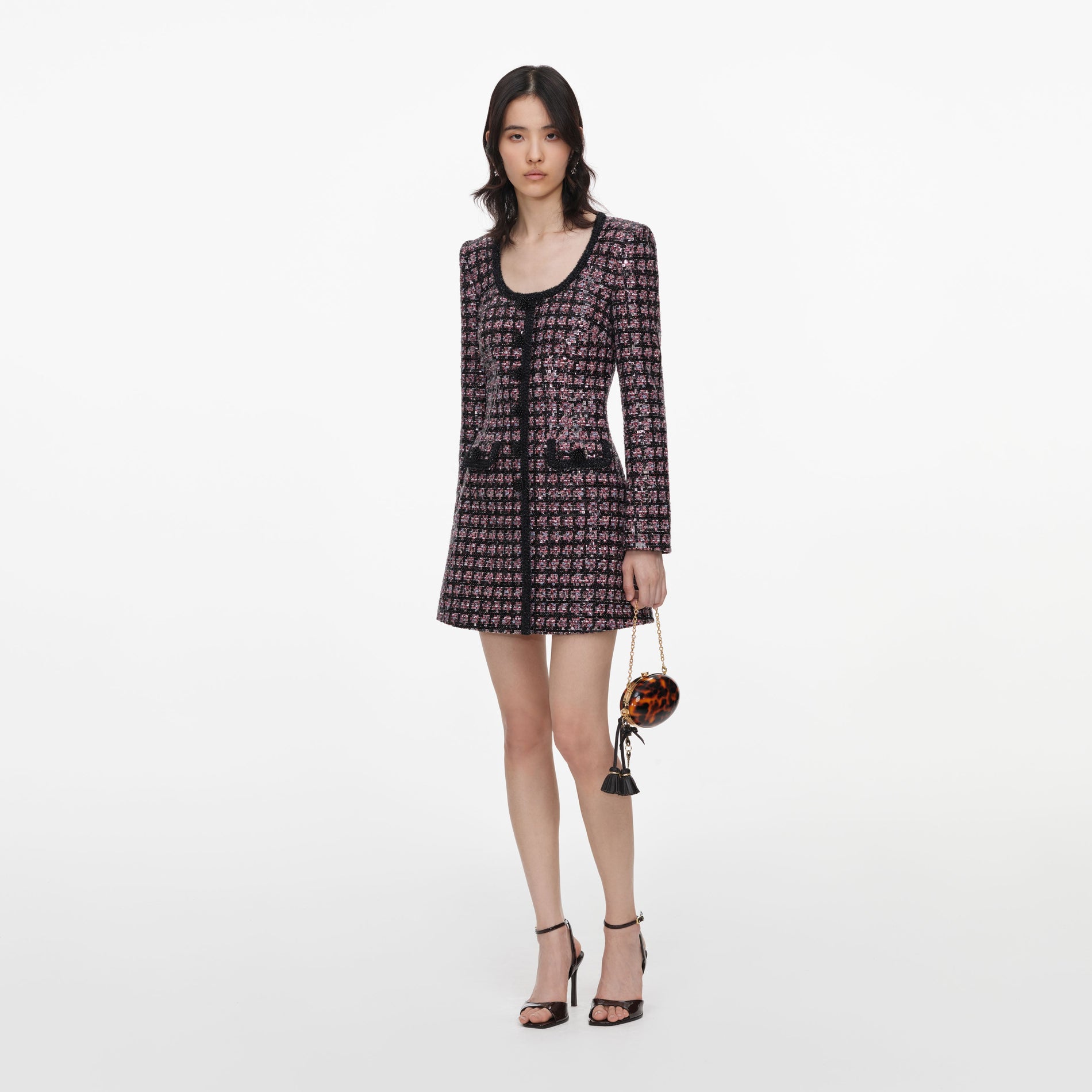 Side view of a woman wearing the Pink and Black Sequin Boucle Mini Dress