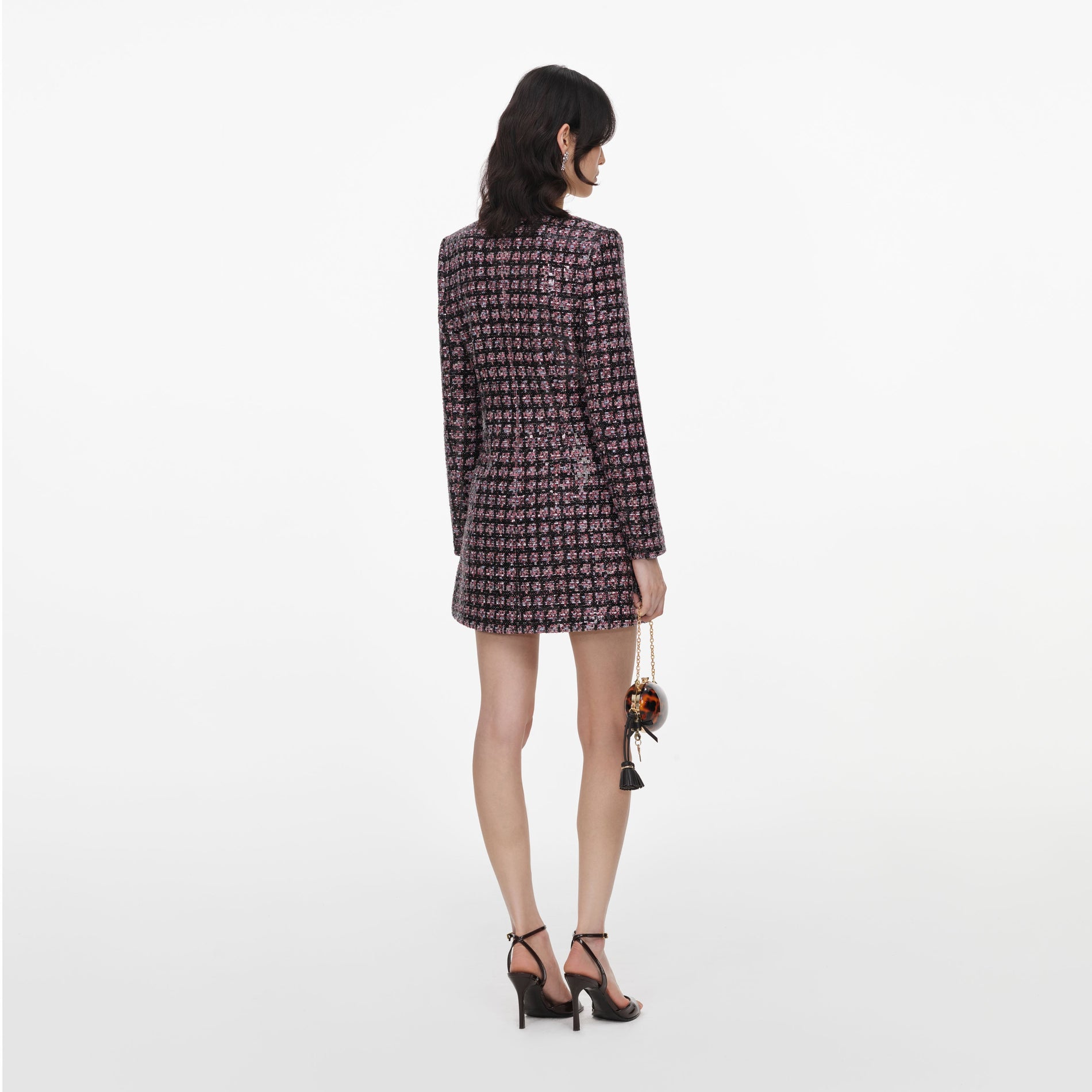 Back view of a woman wearing the Pink and Black Sequin Boucle Mini Dress
