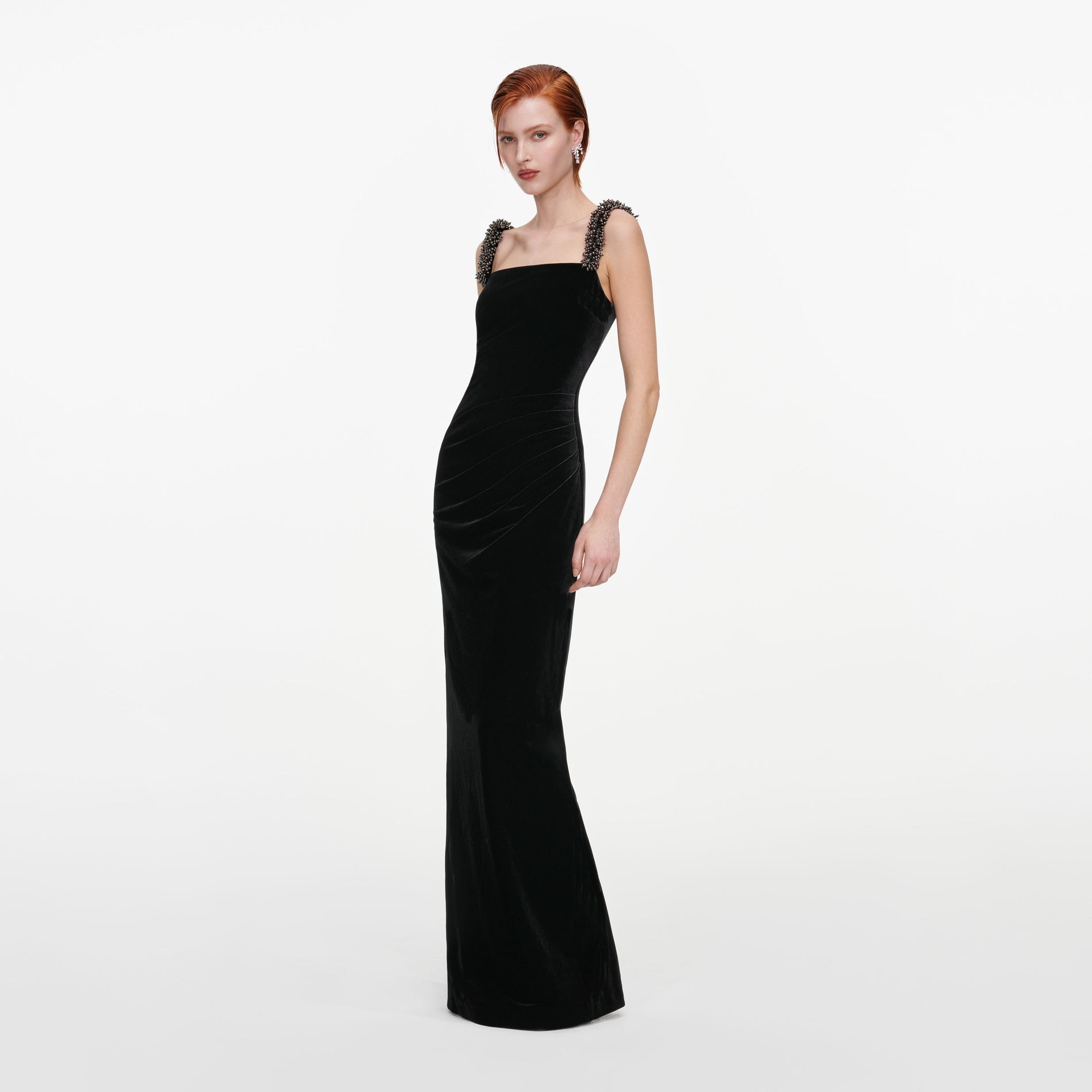 Side view of a woman wearing the Black Velvet Square Neck Maxi Dress