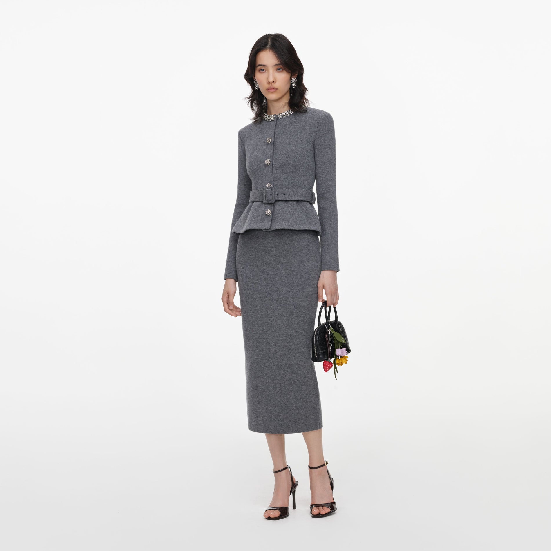 Side view of a woman wearing the Grey Crystal Trim Knit Midi Dress