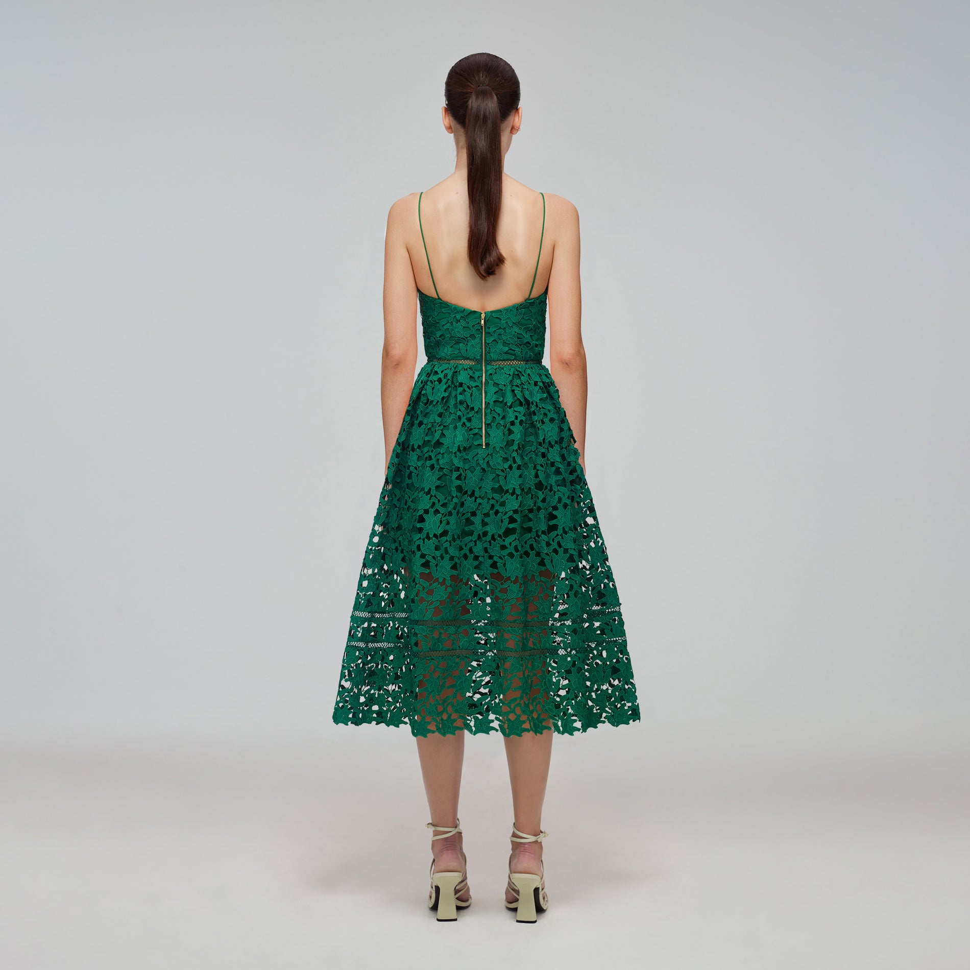 A woman wearing the Green Azaelea Midi Dress