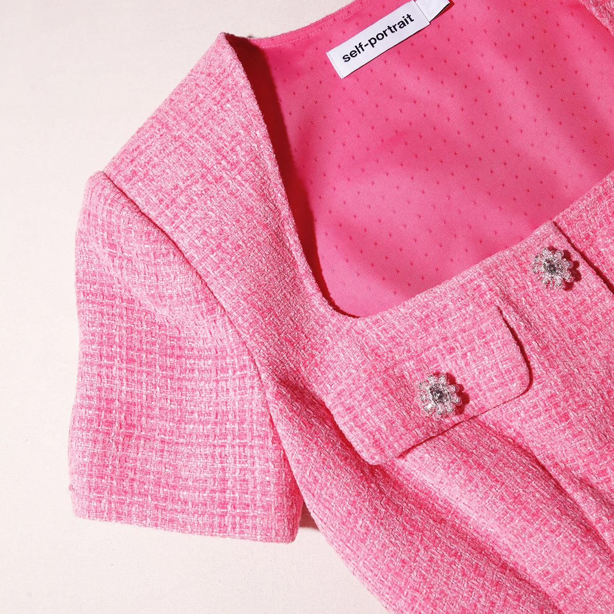 A close up of the fabric for the Pink Boucle Chiffon Midi Dress