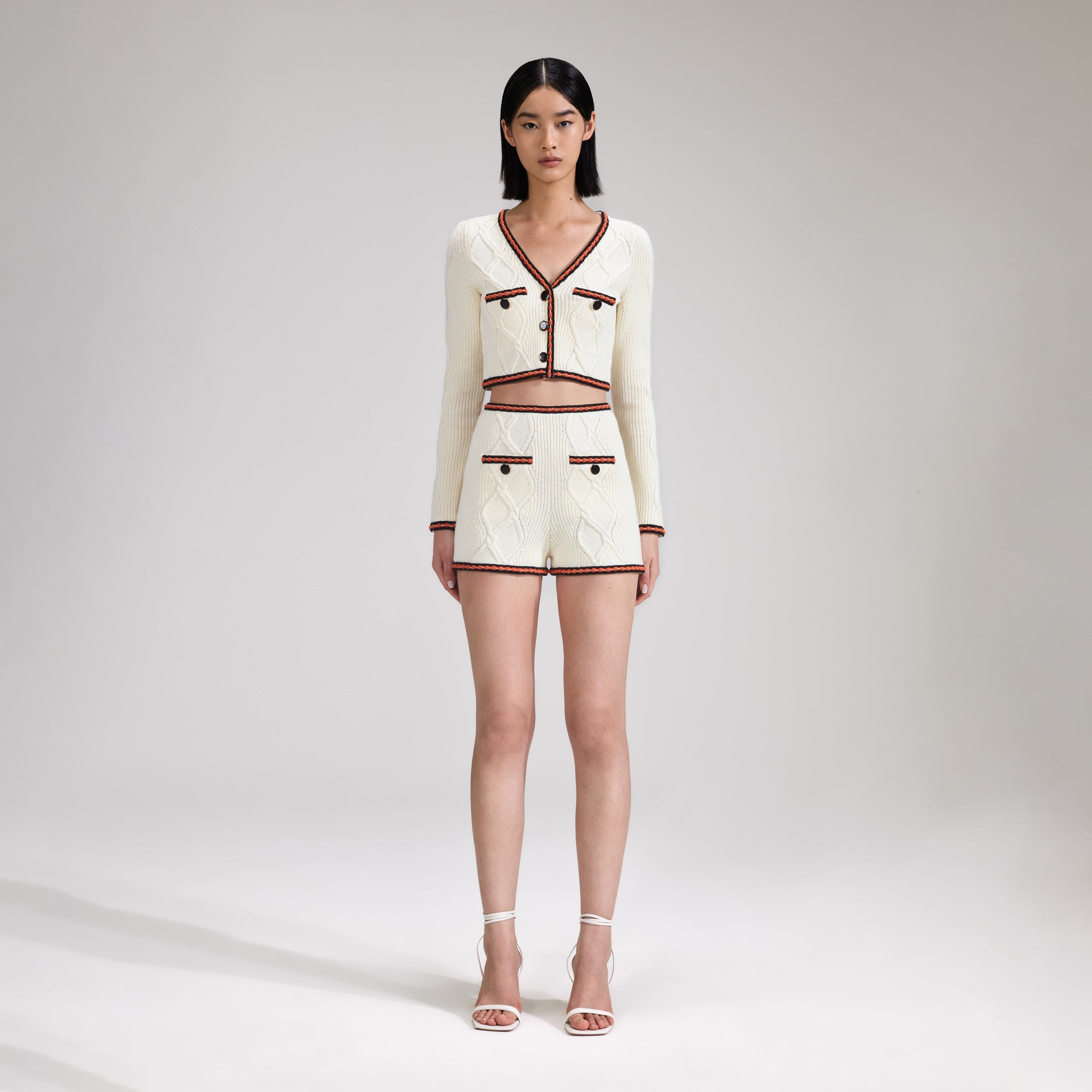 A woman wearing the Cream Cable Knit Short