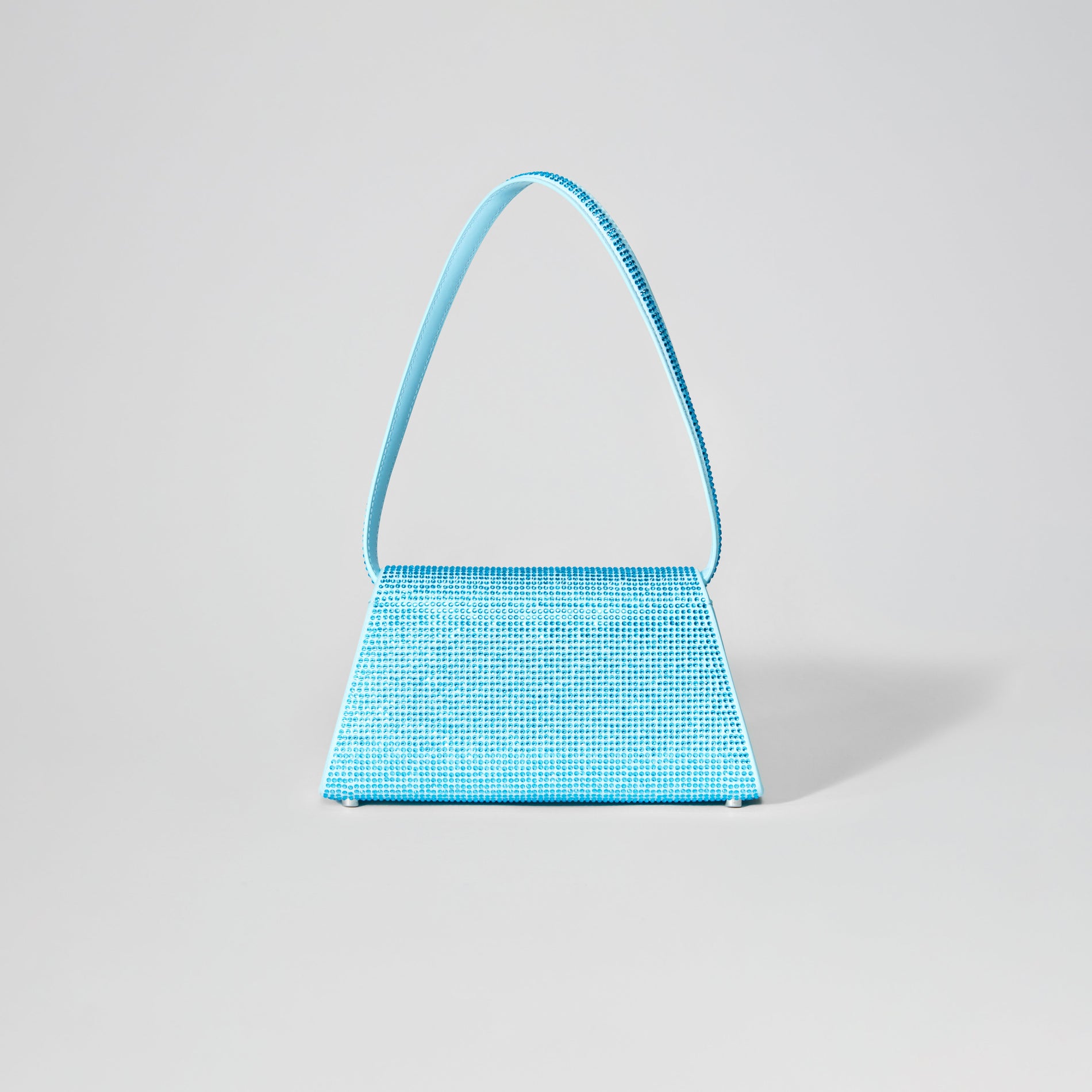 Back view of a woman wearing the Blue Rhinestone Bow Mini Shoulder Bag