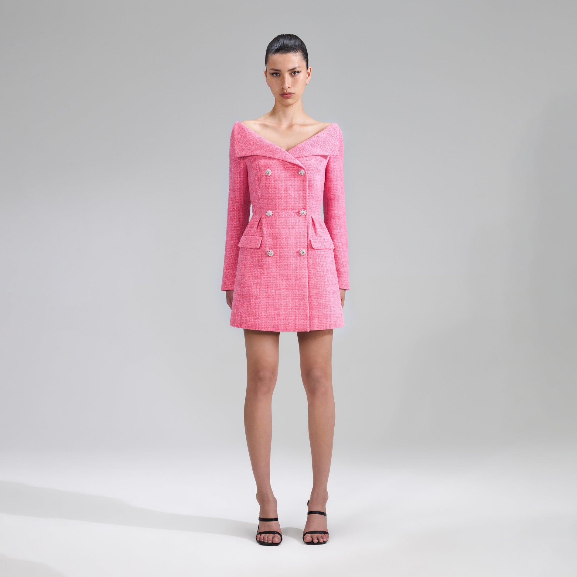 A woman wearing the Pink Boucle Mini Dress