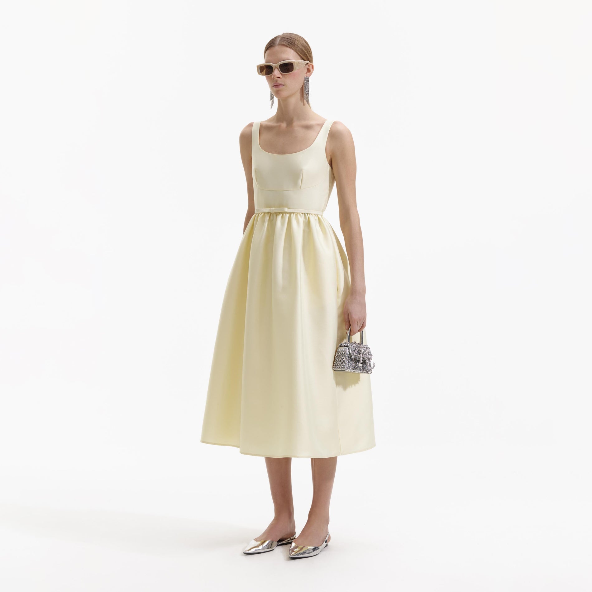 Side view of a woman wearing the Yellow Taffeta Midi Dress
