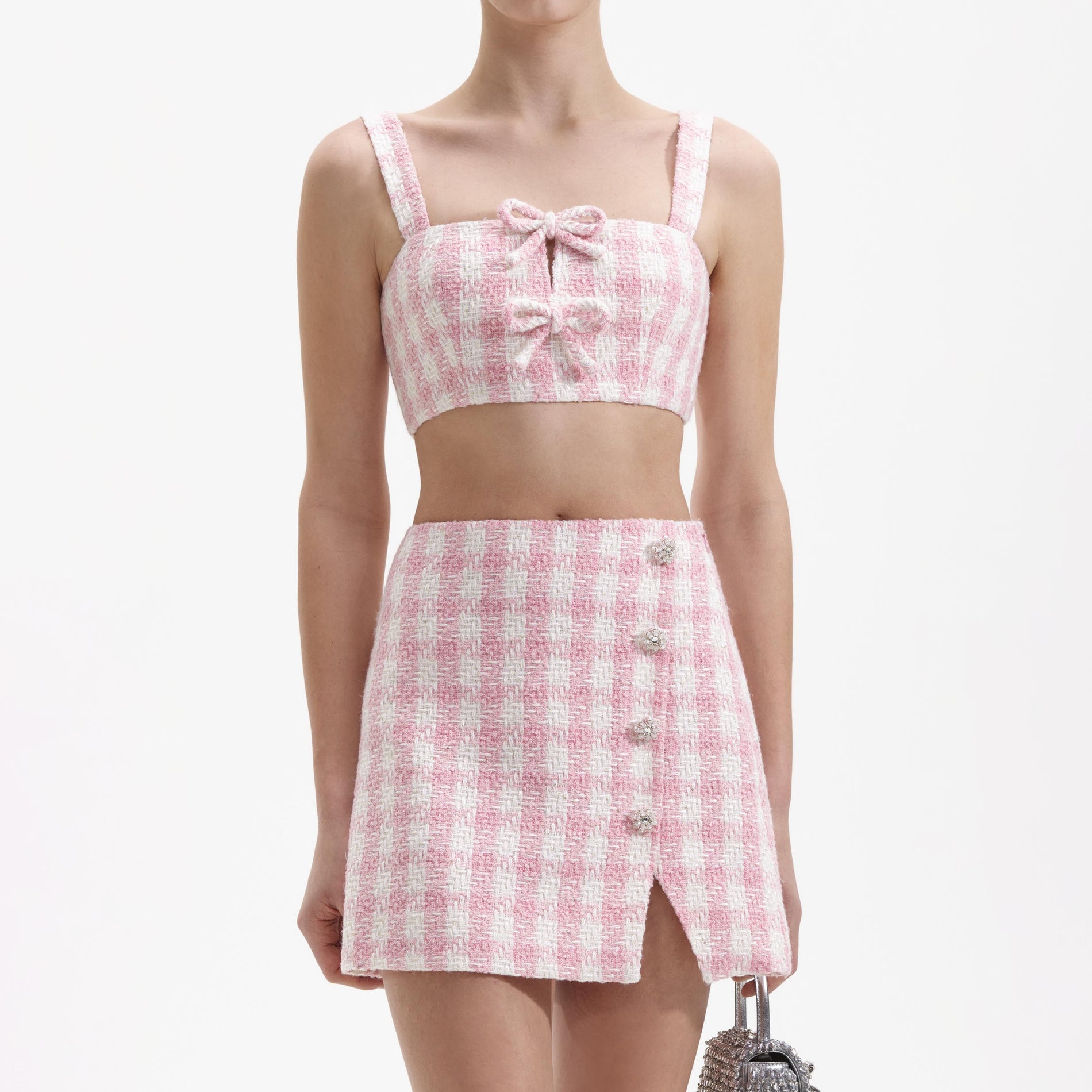 A close up of a woman wearing the Pink Check Boucle Crop Top