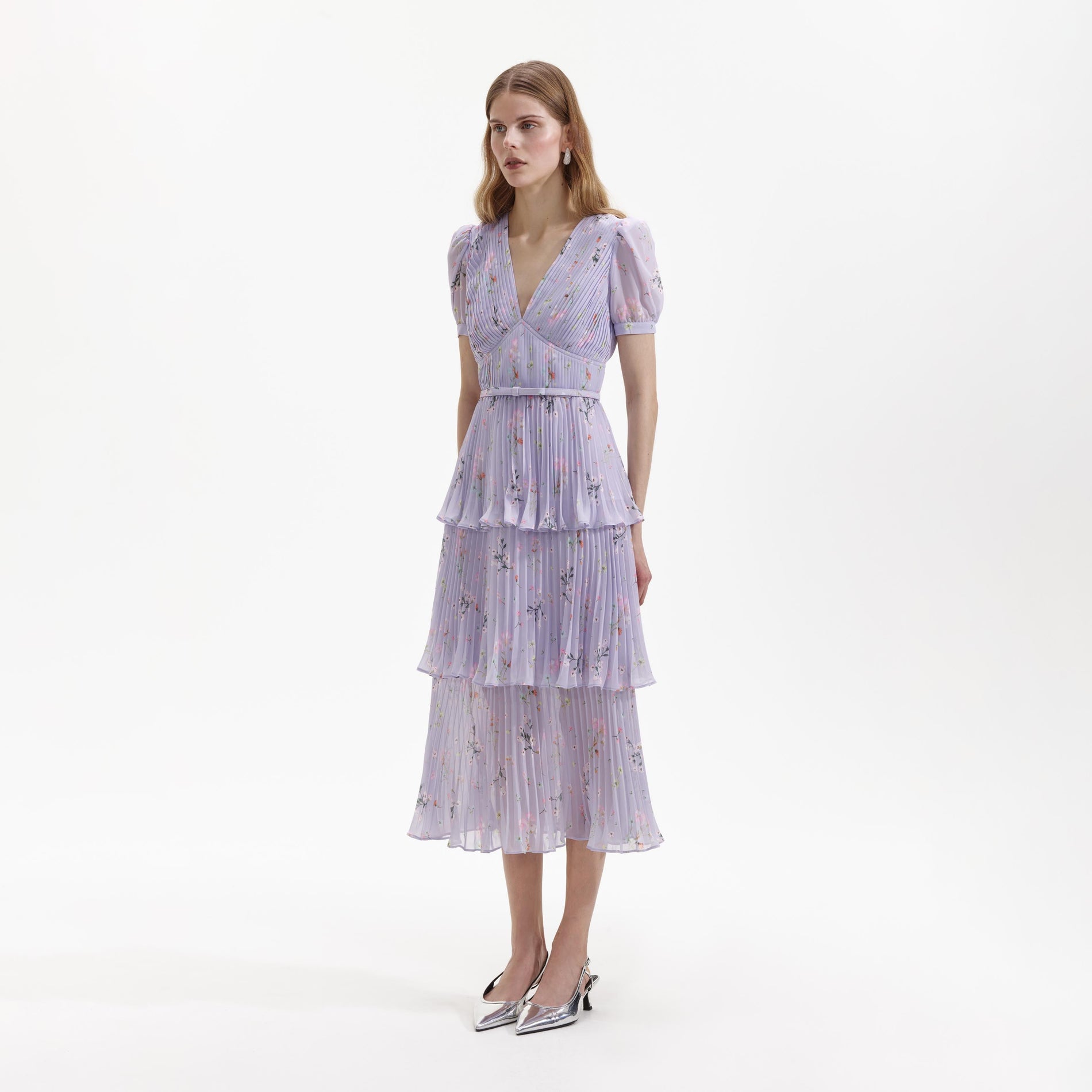 Side view of a woman wearing the Lilac Floral Midi Dress