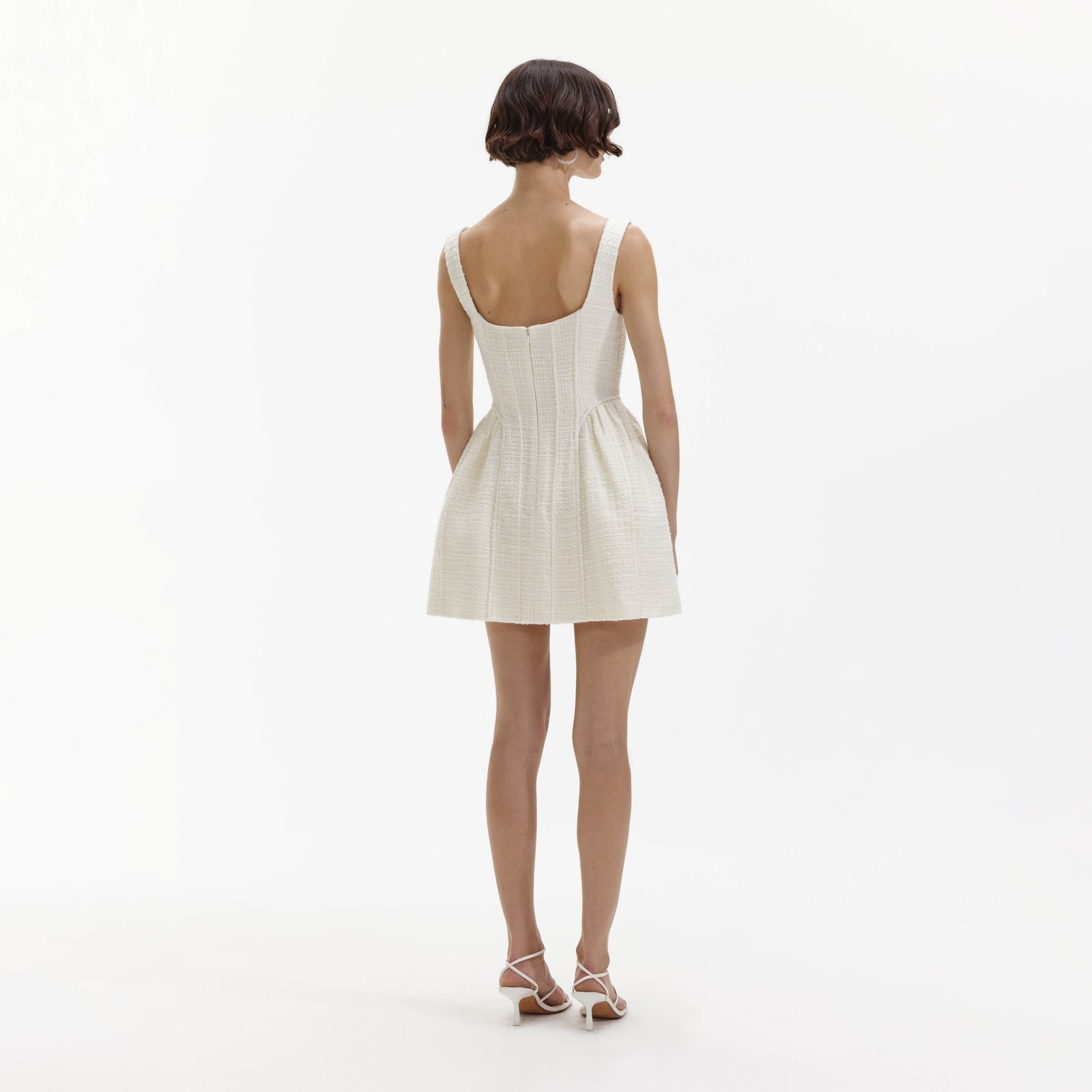A Woman wearing the Cream Boucle Mini Dress