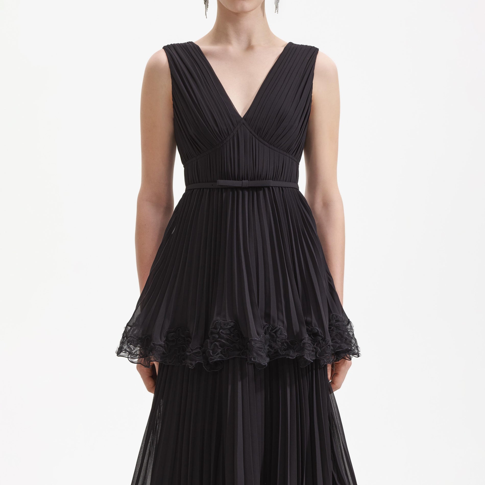 A close up of a woman wearing the Black Chiffon Tier Midi Dress