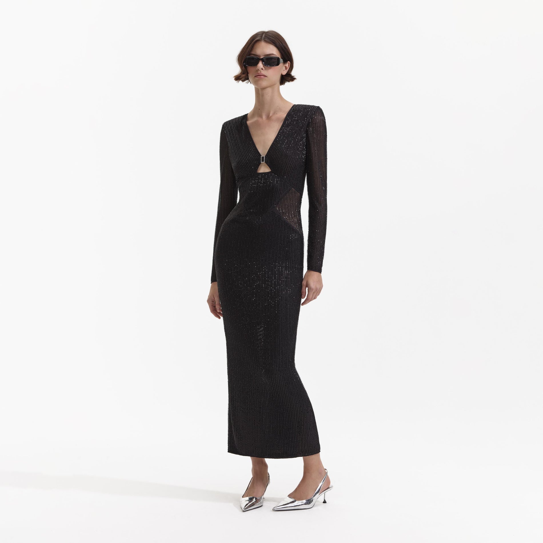 Side view of a woman wearing the Black Beaded Mesh Midi Dress