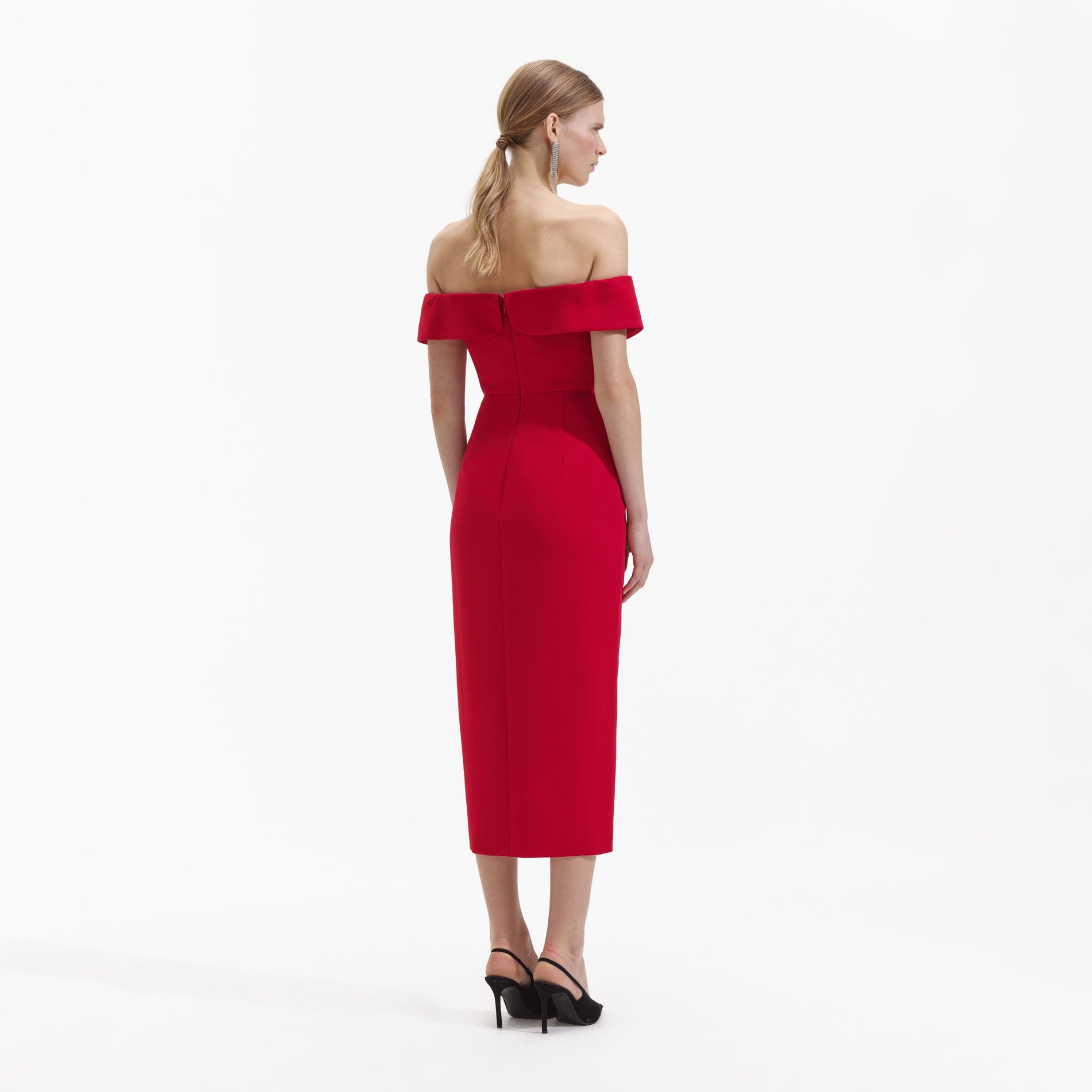 Back view of a woman wearing the Red Crepe Off Shoulder Bow Midi Dress