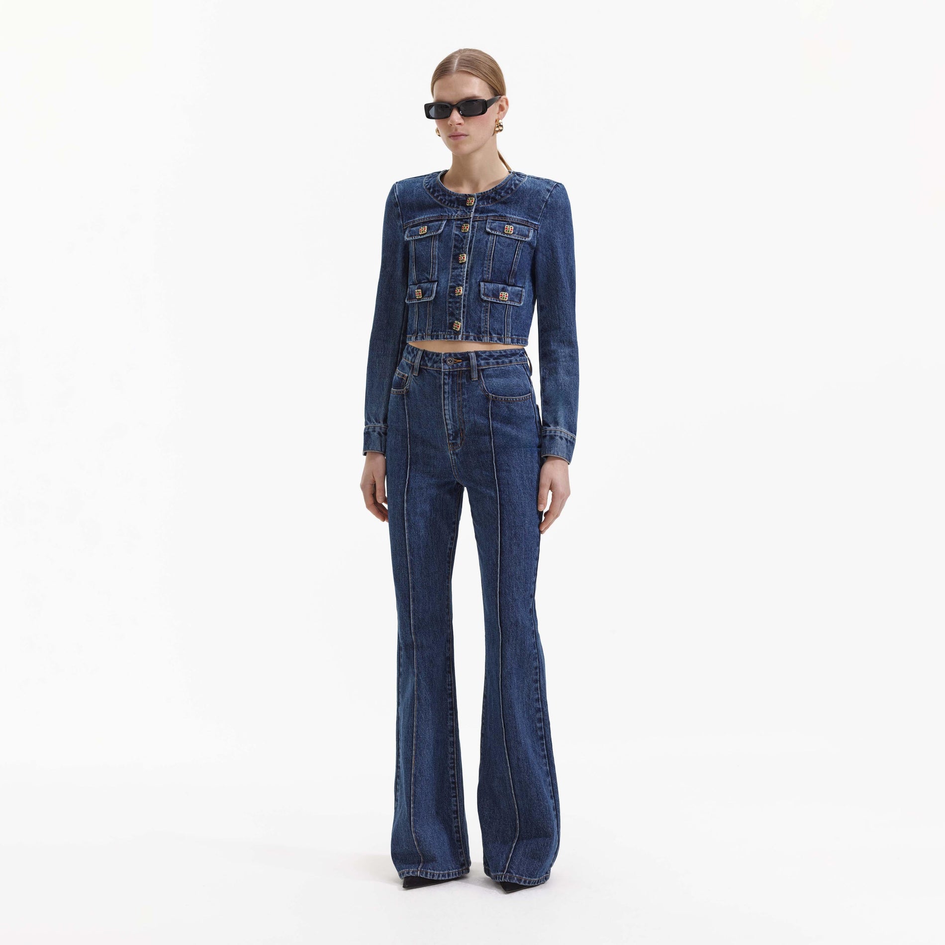 Side view of a woman wearing the Buttoned Denim Jacket