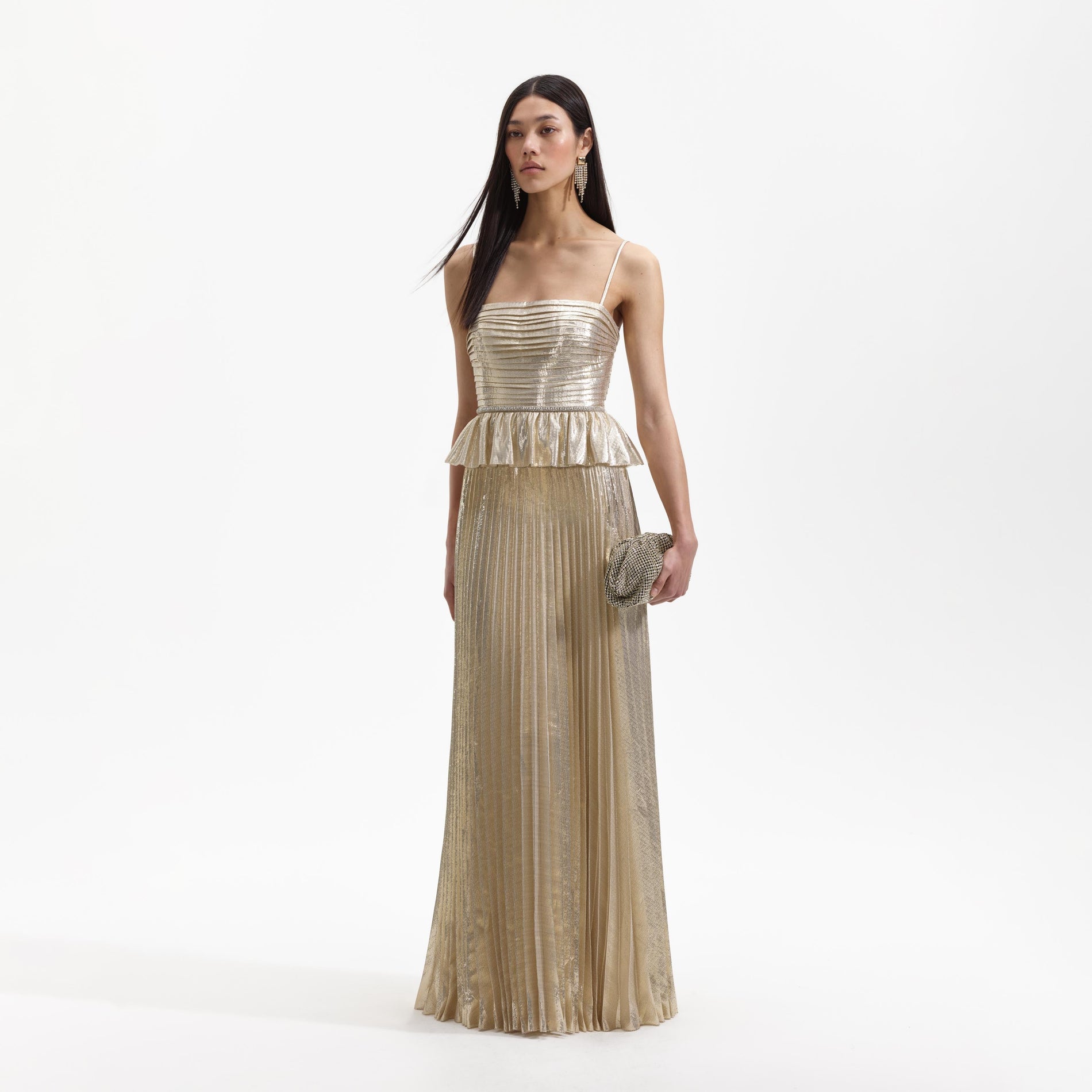 Side view of a woman wearing the Gold Metallic Maxi Dress