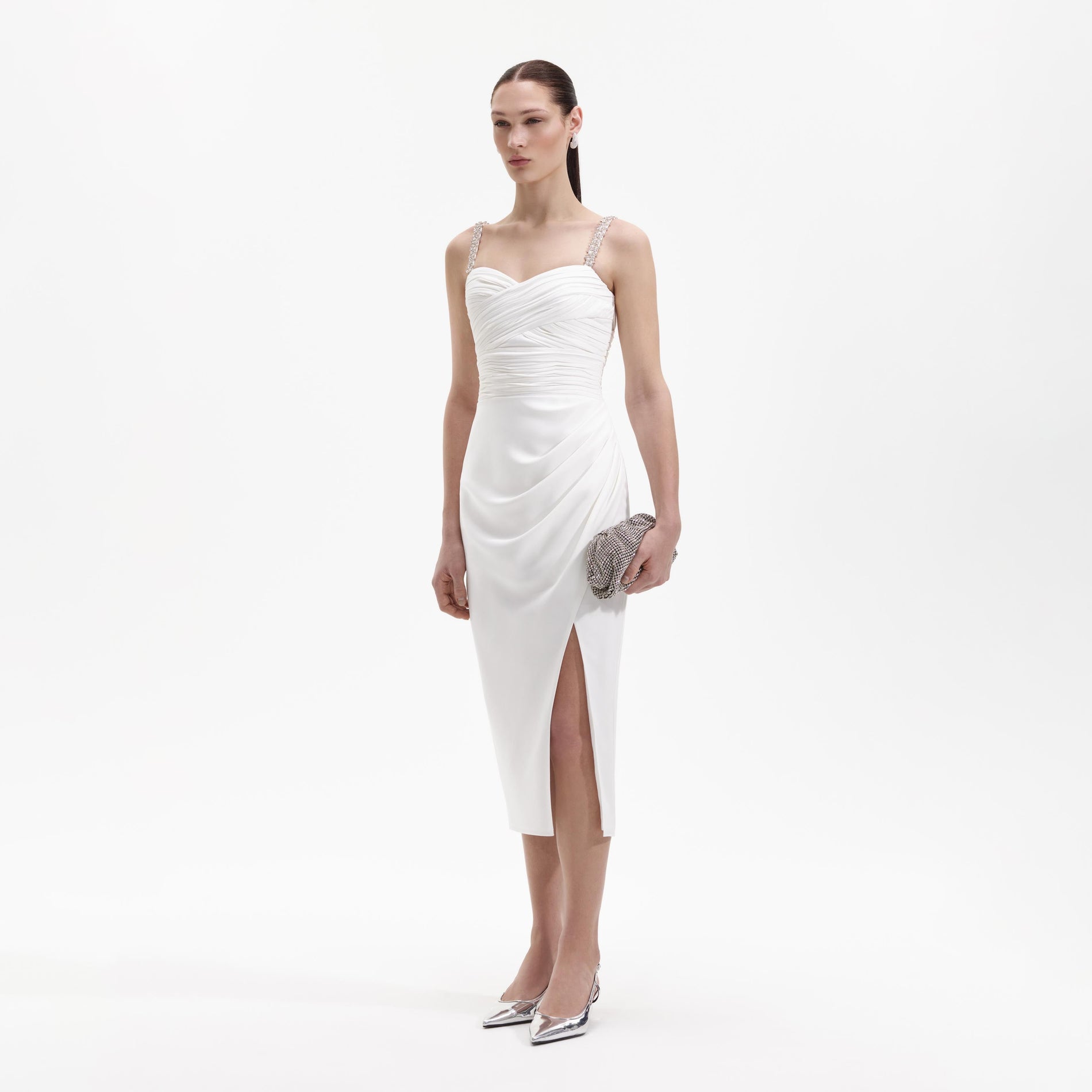Side view of a woman wearing the White Stretch Crepe Diamante Midi Dress