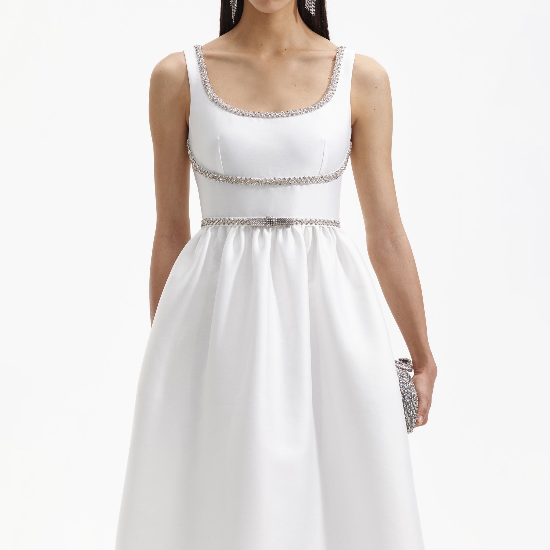 A close up of a woman wearing the White Taffeta A Line Midi Dress