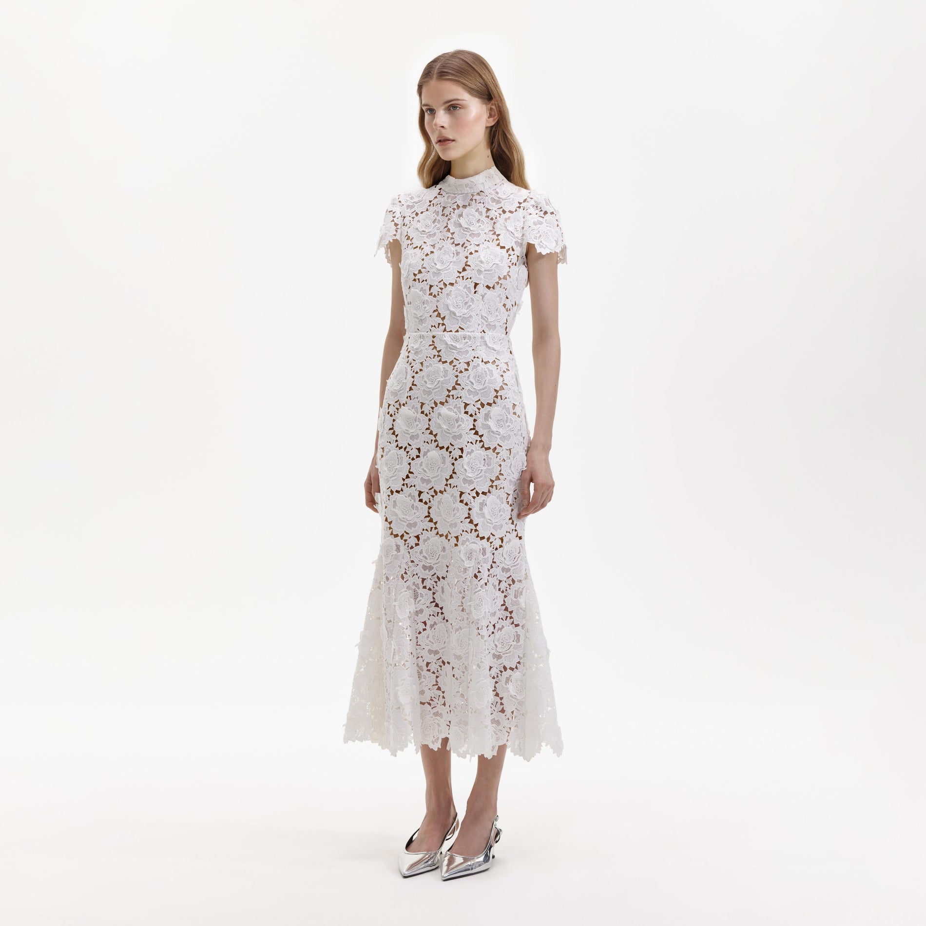 Side view of a woman wearing the White Flower Lace Midi Dress