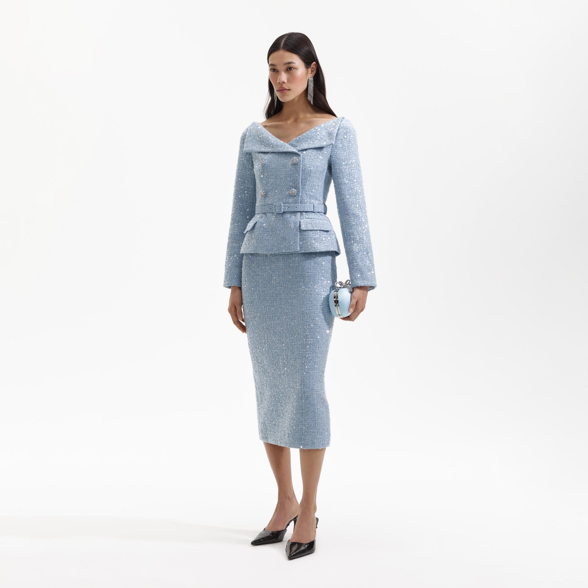 Side view of a woman wearing the Blue Sequin Boucle Midi Dress