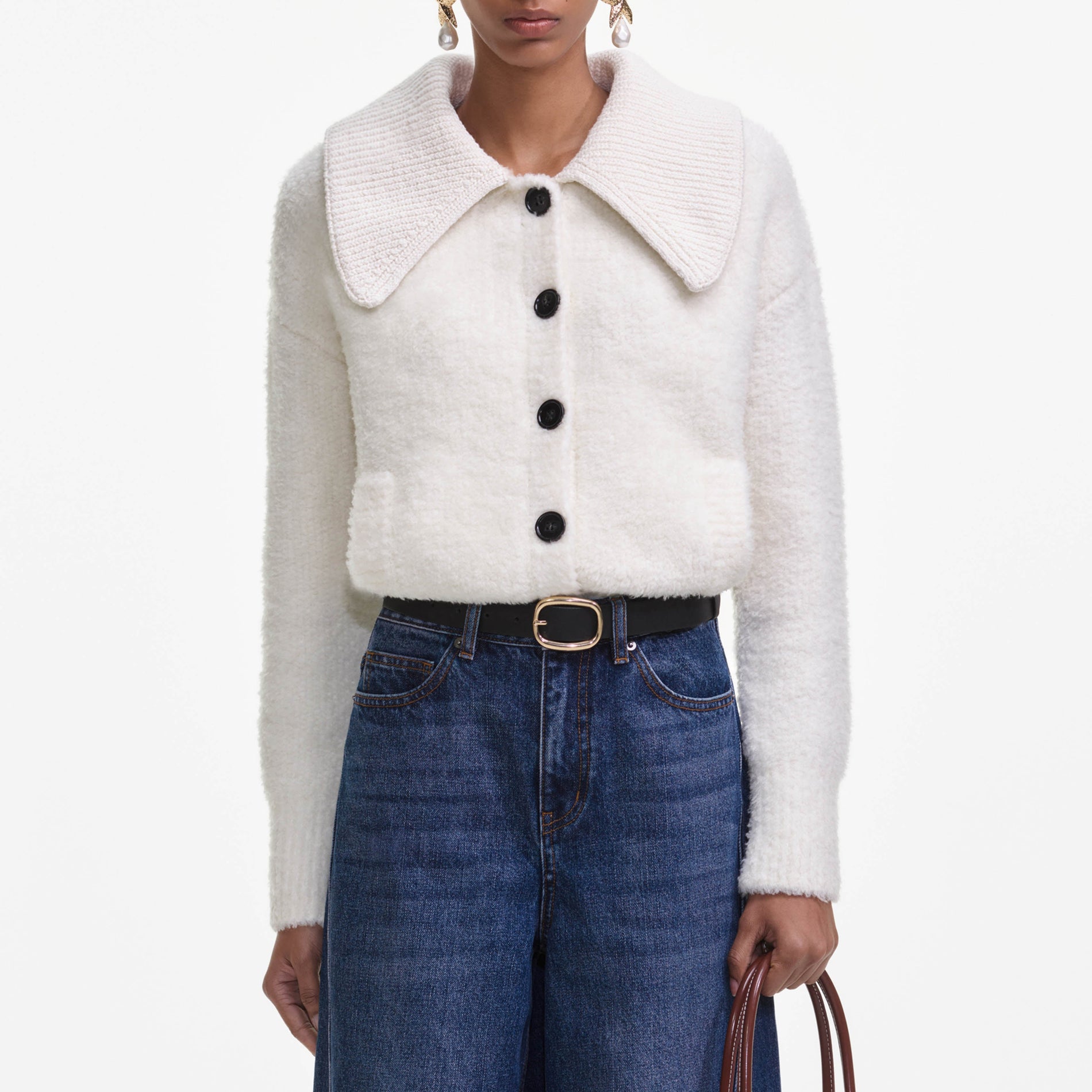 A close up of a woman wearing the Cream Fluffy Knit Cardigan