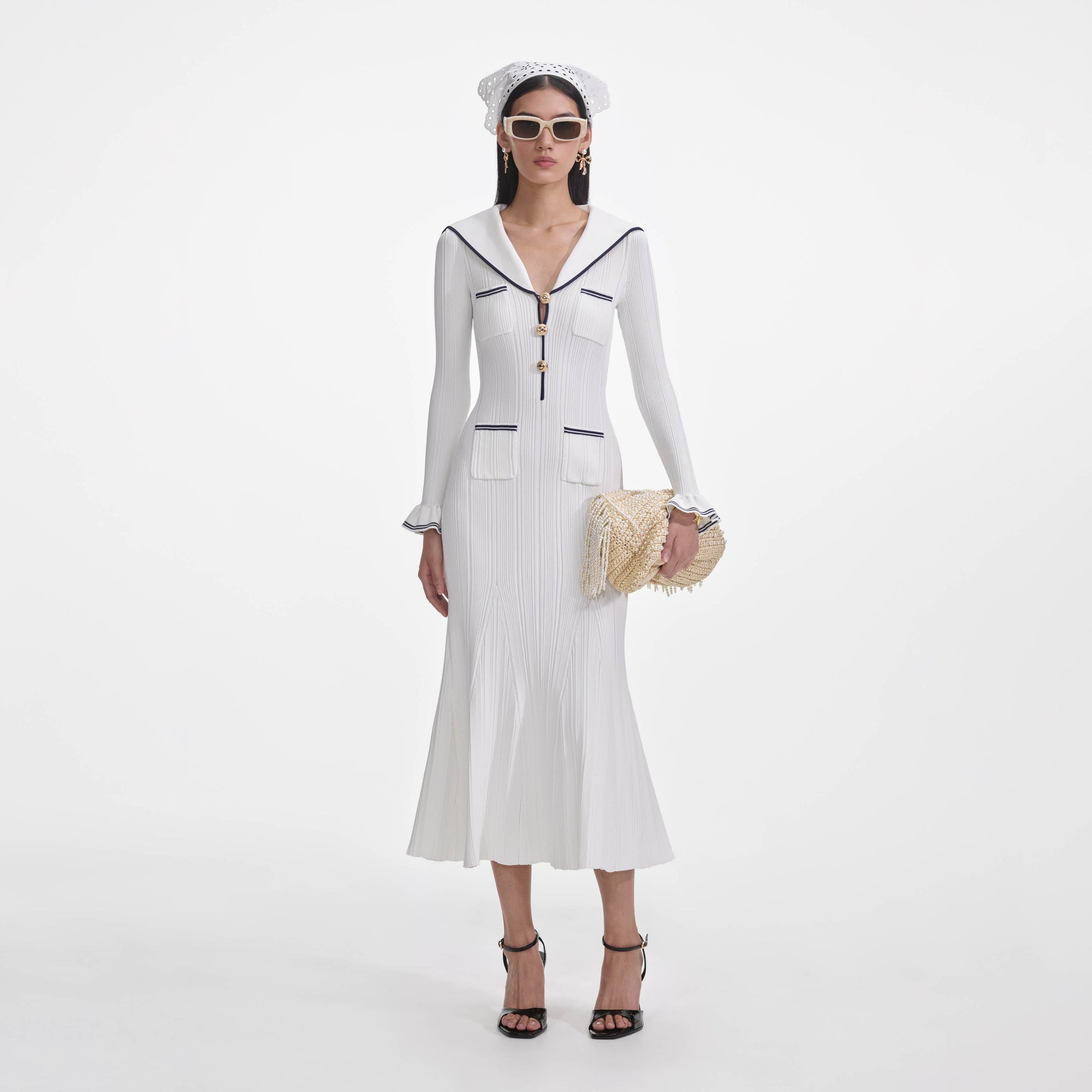 Front view of a woman wearing the White Viscose Rib Knit Midi Dress