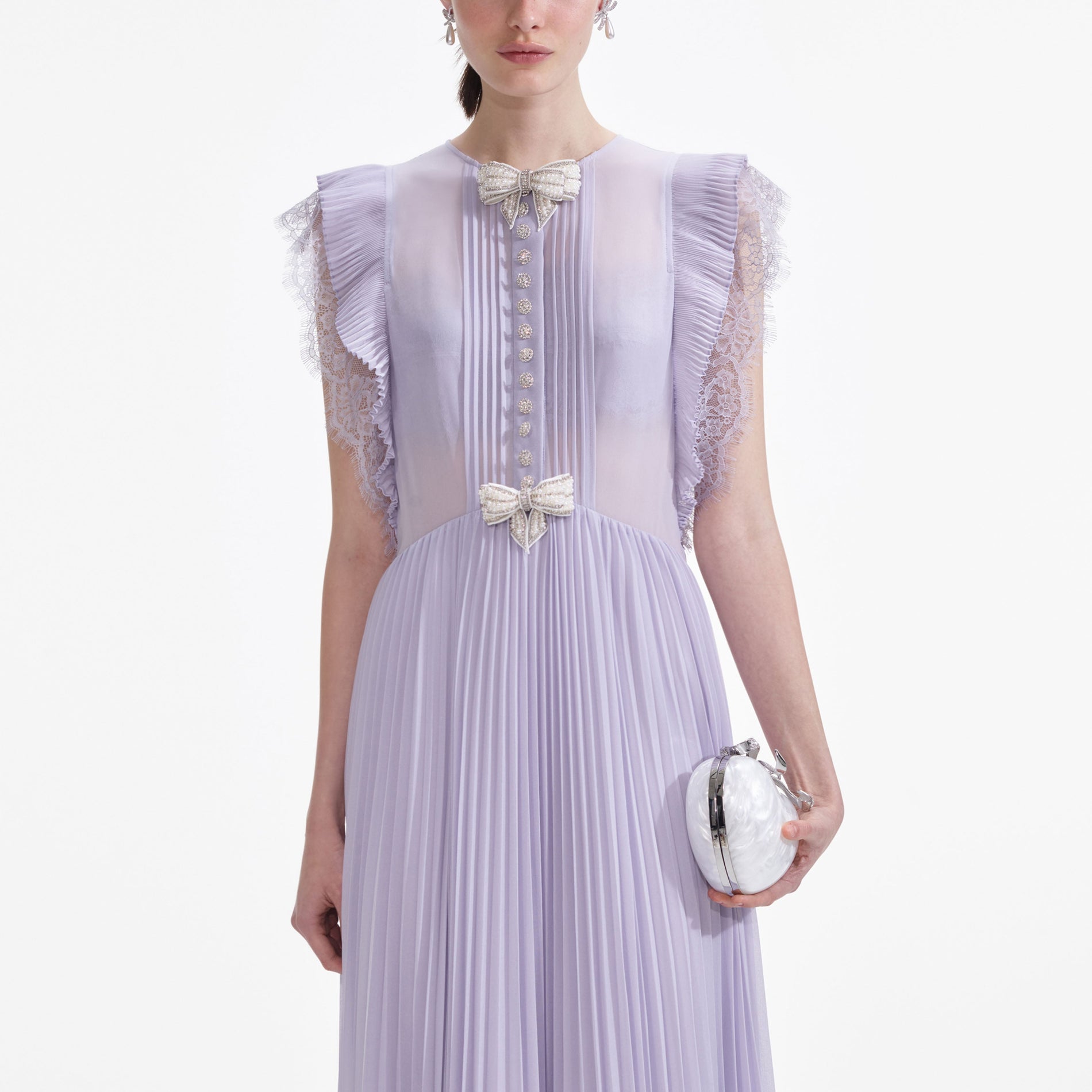 A close up of a woman wearing the Lilac Chiffon Ruffle Maxi Dress