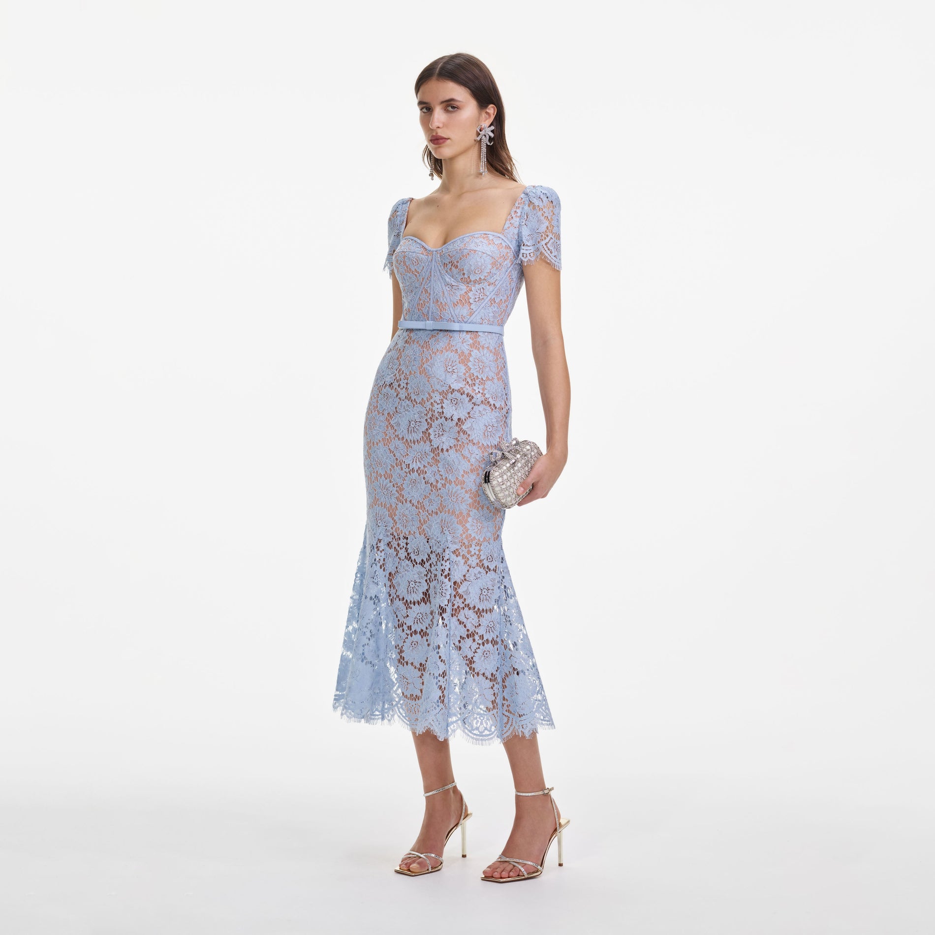 Side view of a woman wearing the Blue Fine Lace Midi Dress