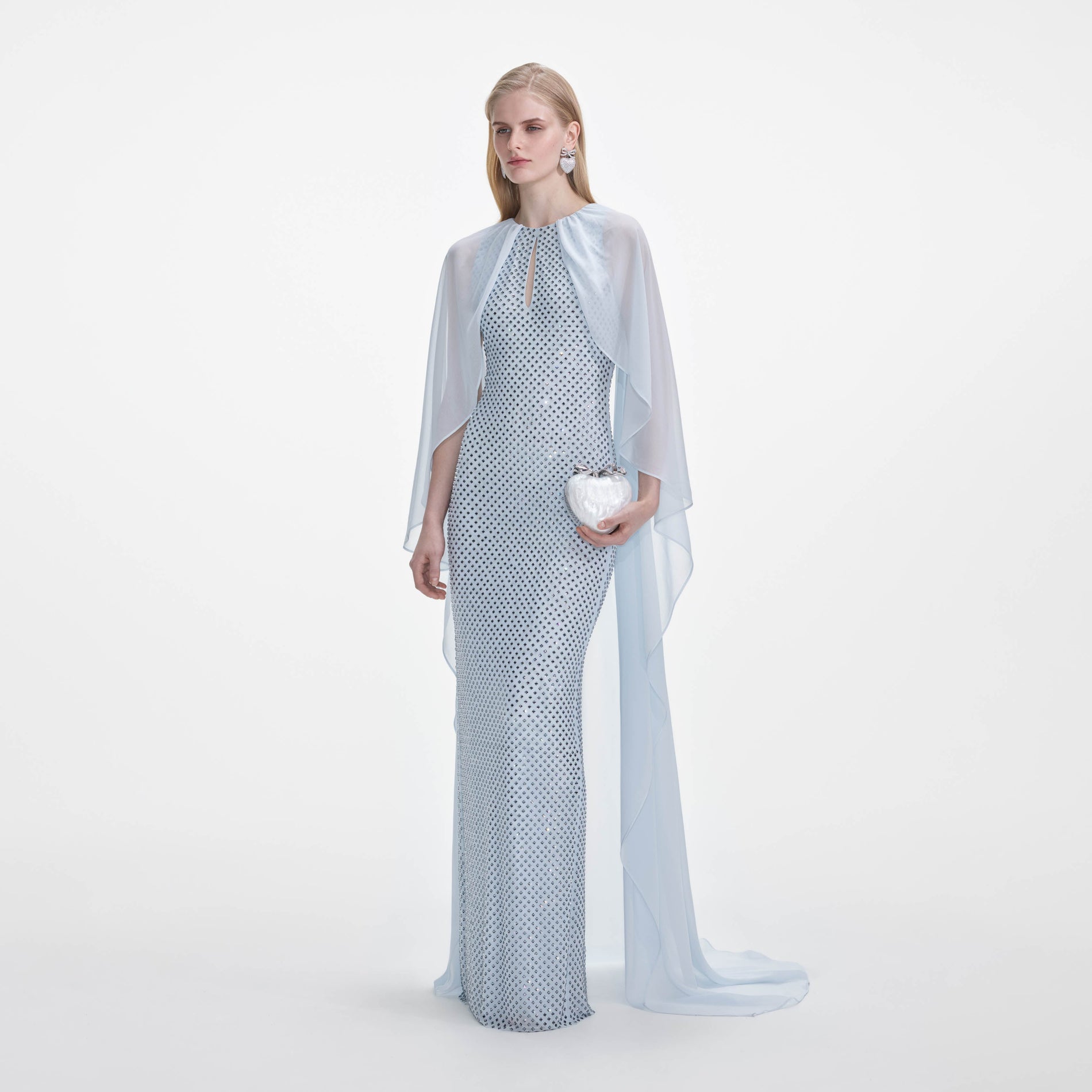 Side view of a woman wearing the Pale Blue Rhinestone Cape Maxi Dress