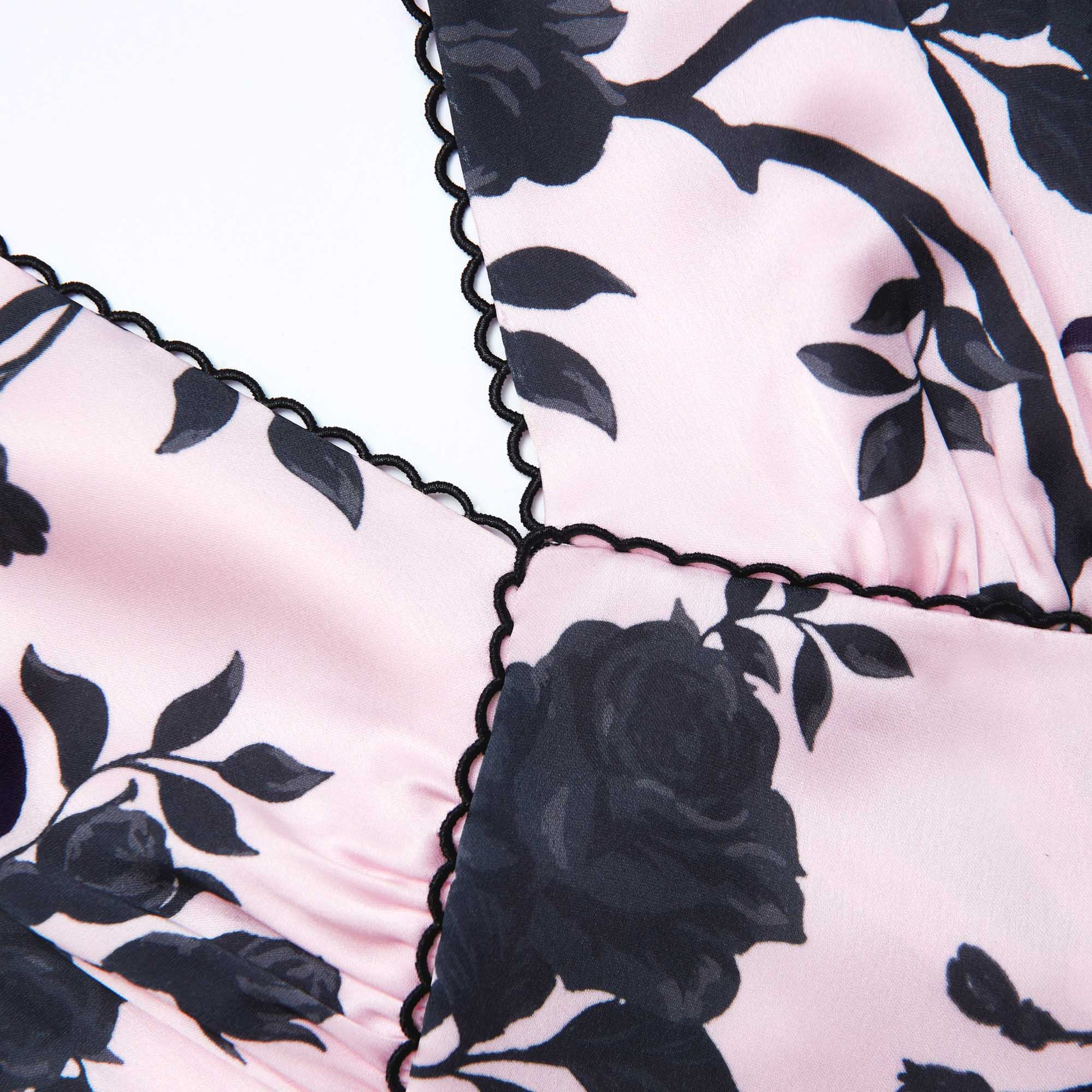 Side view of a woman wearing the Pink Satin Floral Midi Dress