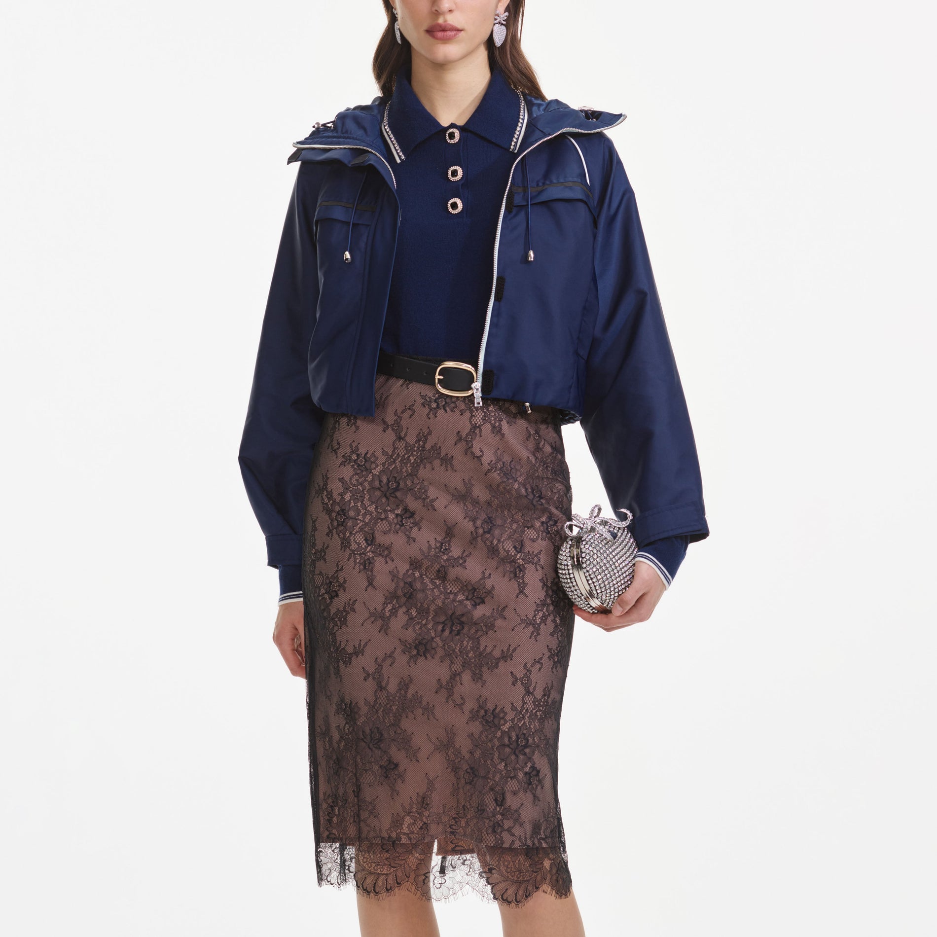 A close up of a woman wearing the Navy Nylon Windbreaker