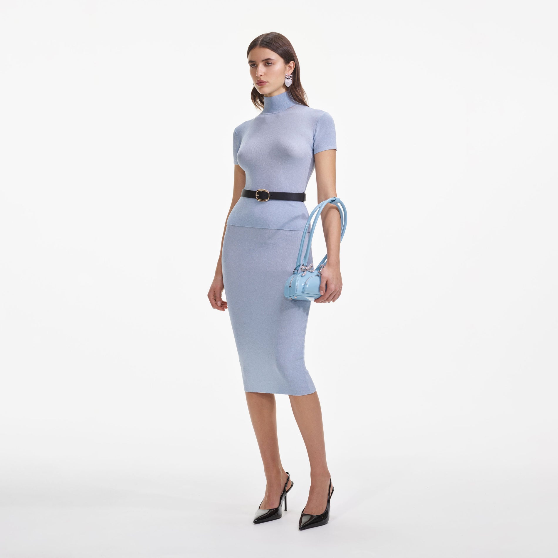 Side view of a woman wearing the Blue Viscose Knit Midi Skirt