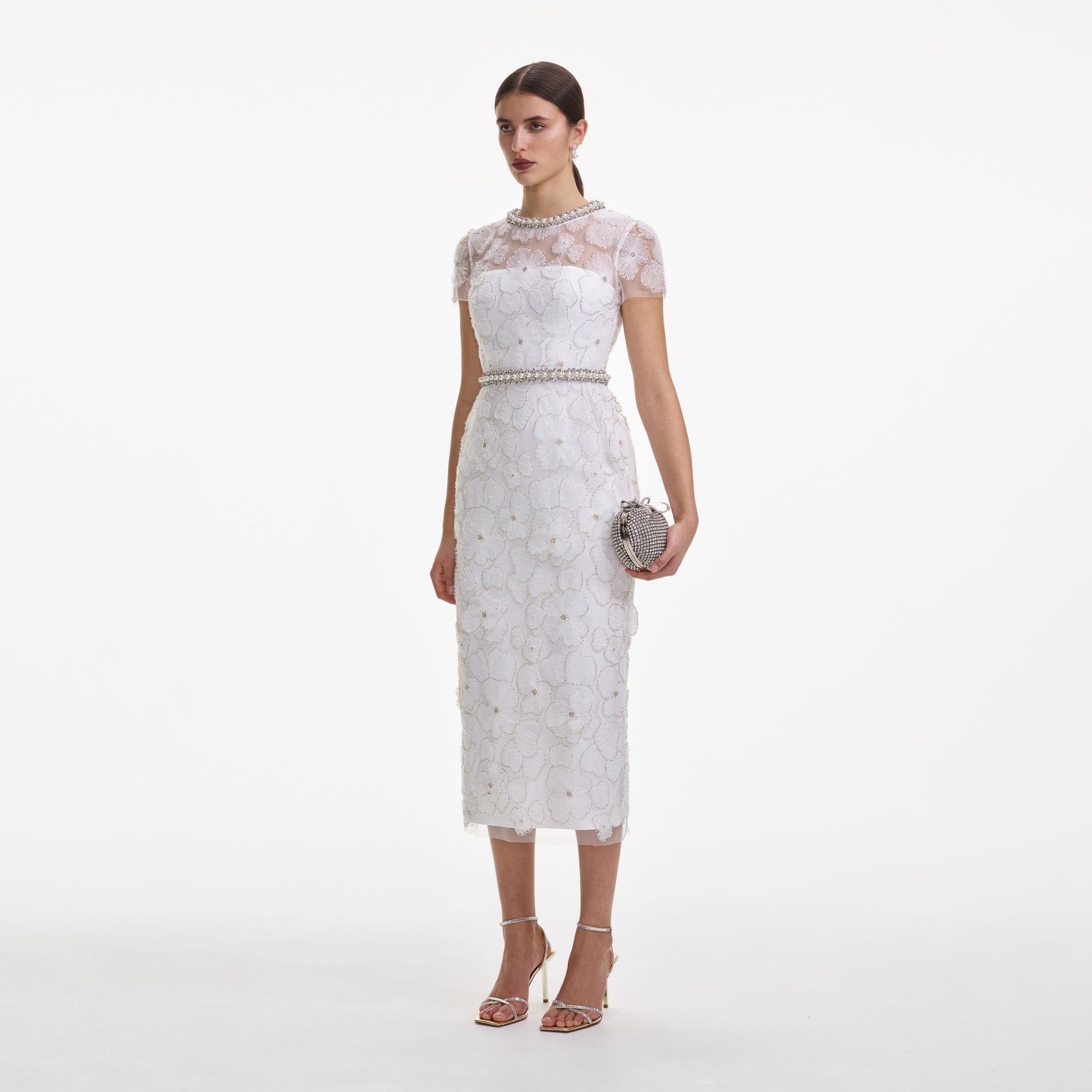 Side view of a woman wearing the White Embellished Tulle Midi Dress
