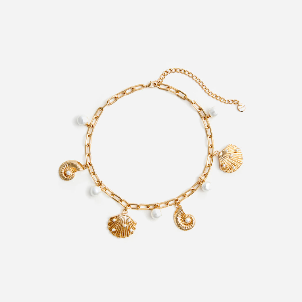 A photo of the Gold Pearl Shell Charm Necklace