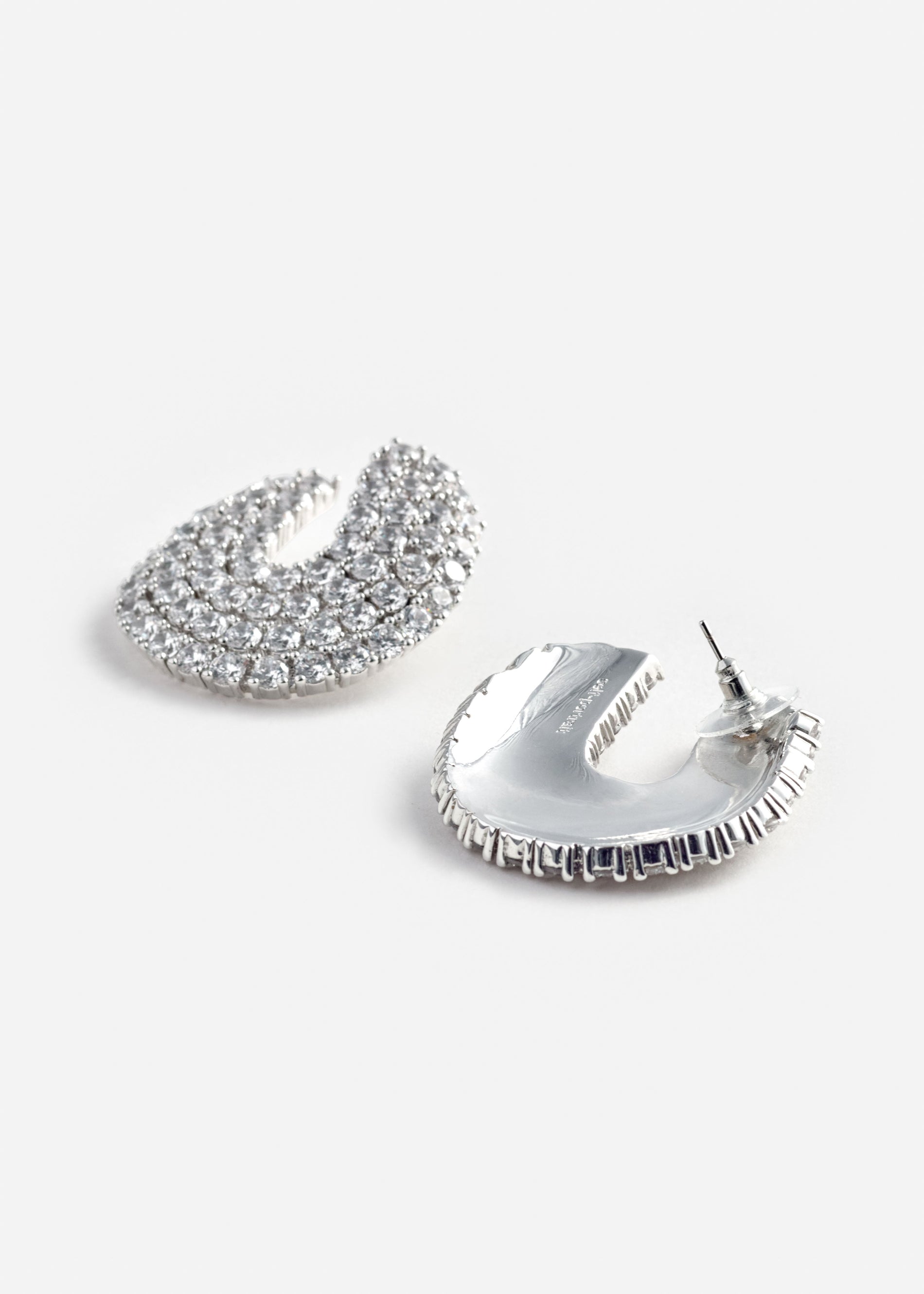A photo of the Crystal Curved Earrings