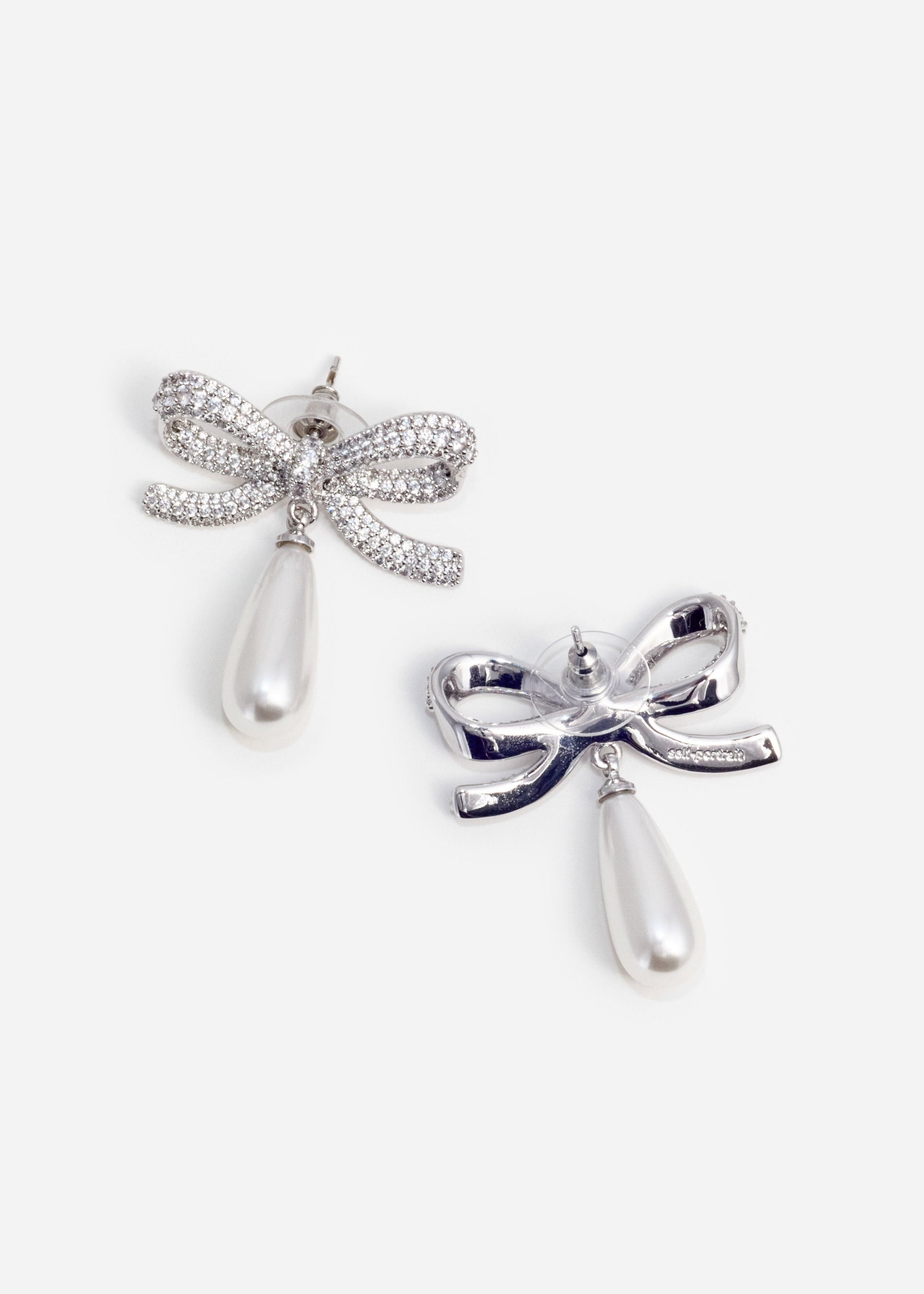 A photo of the Crystal Bow Pearl Droplet Earrings
