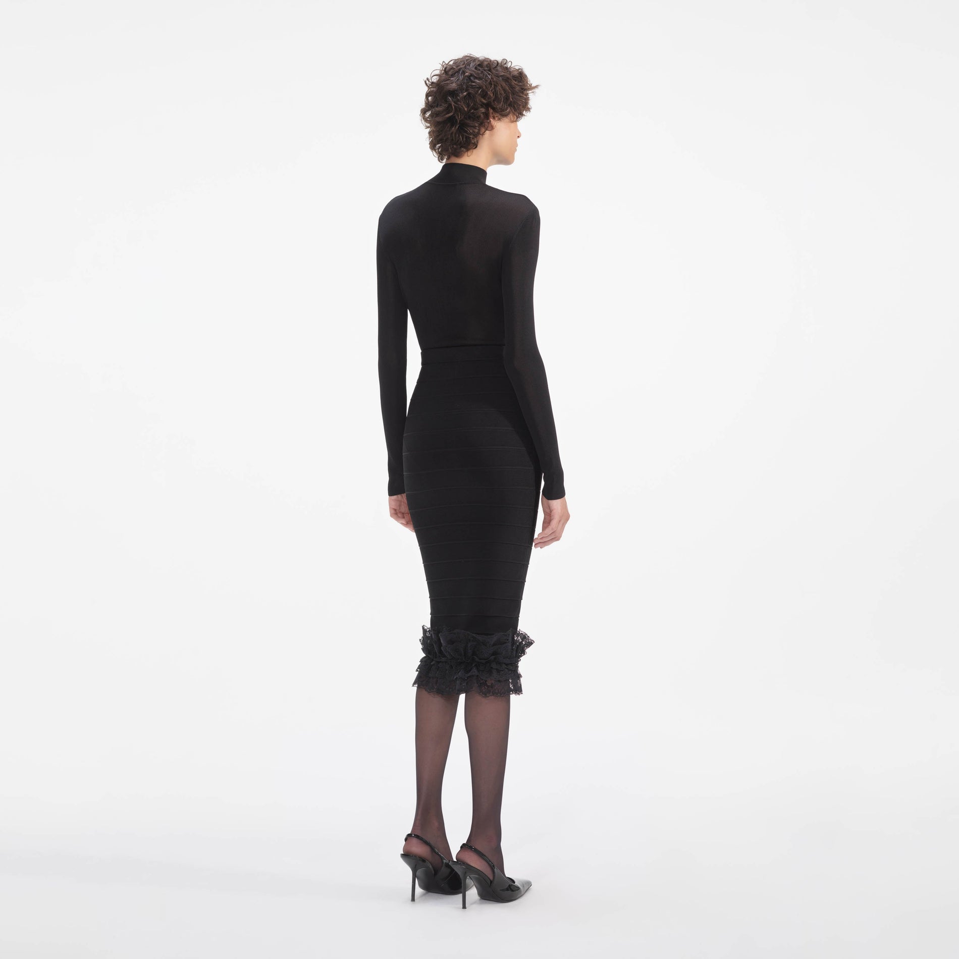 Back view of a woman wearing the Black Knit Cut Out Bodysuit