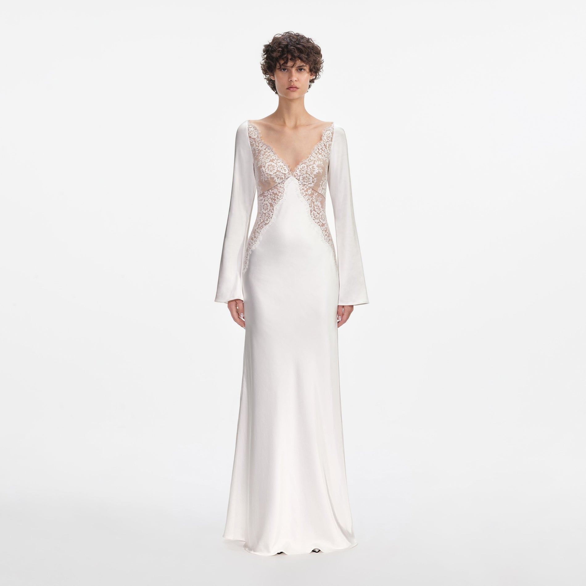 Front view of a woman wearing the White Lace Satin Long Sleeve Maxi Dress