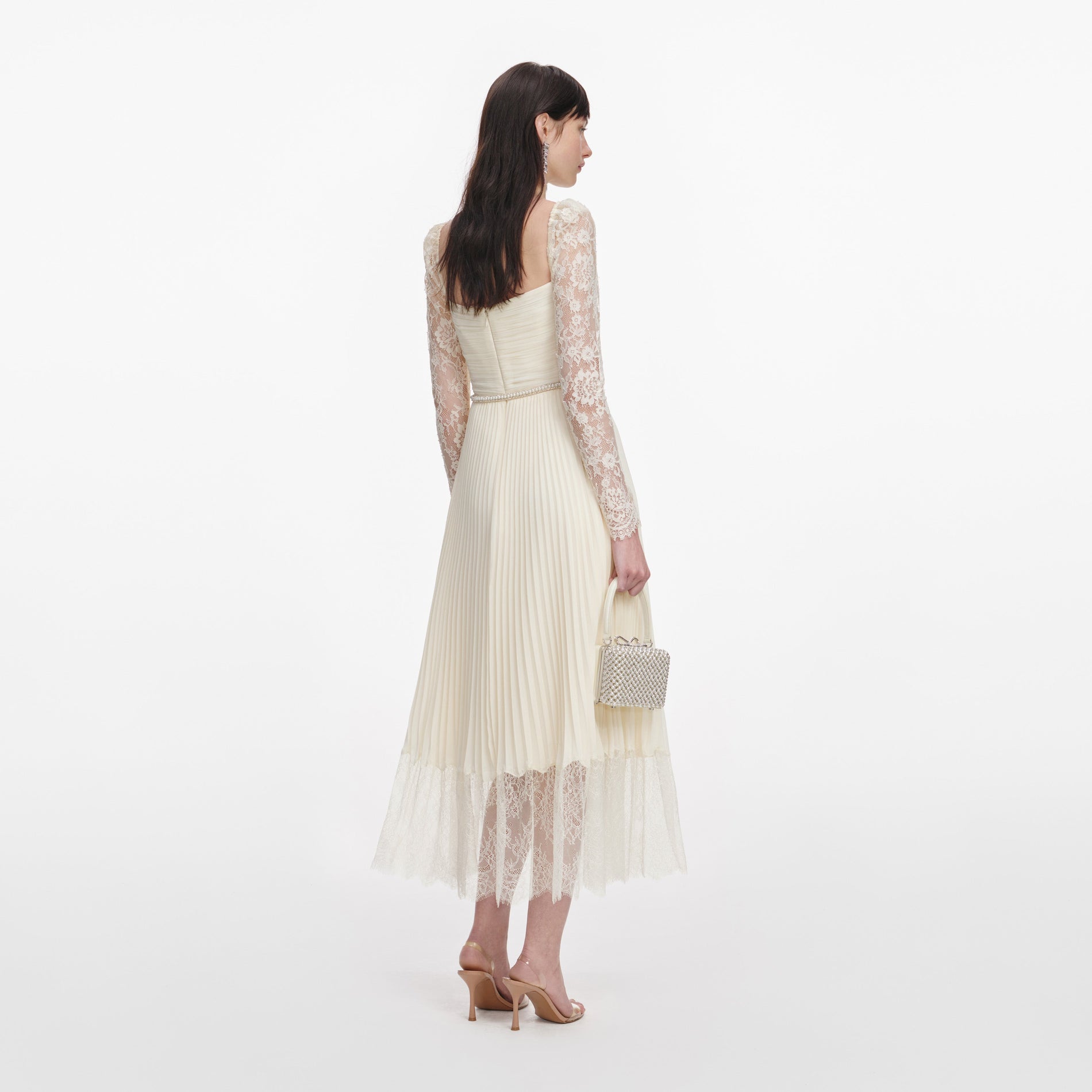 Back view of a woman wearing the Cream Chiffon Lace Midi Dress