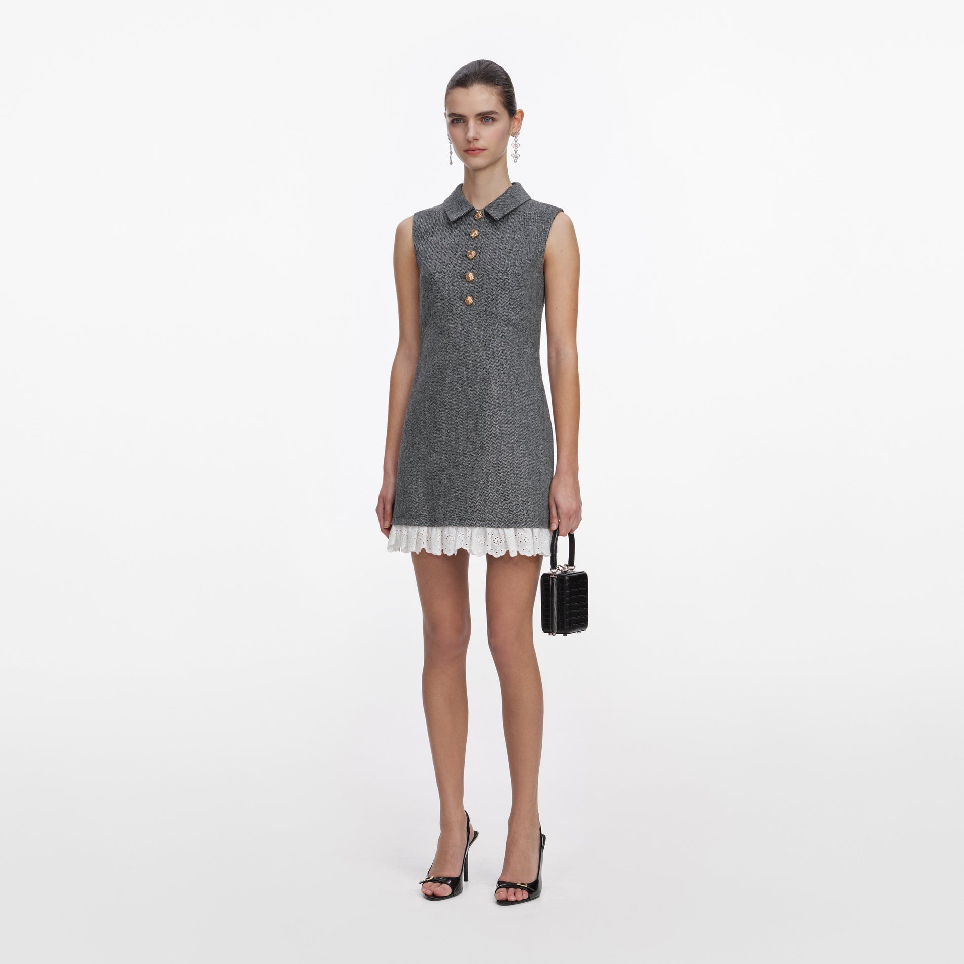 Side view of a woman wearing the Grey Herringbone Mini Dress