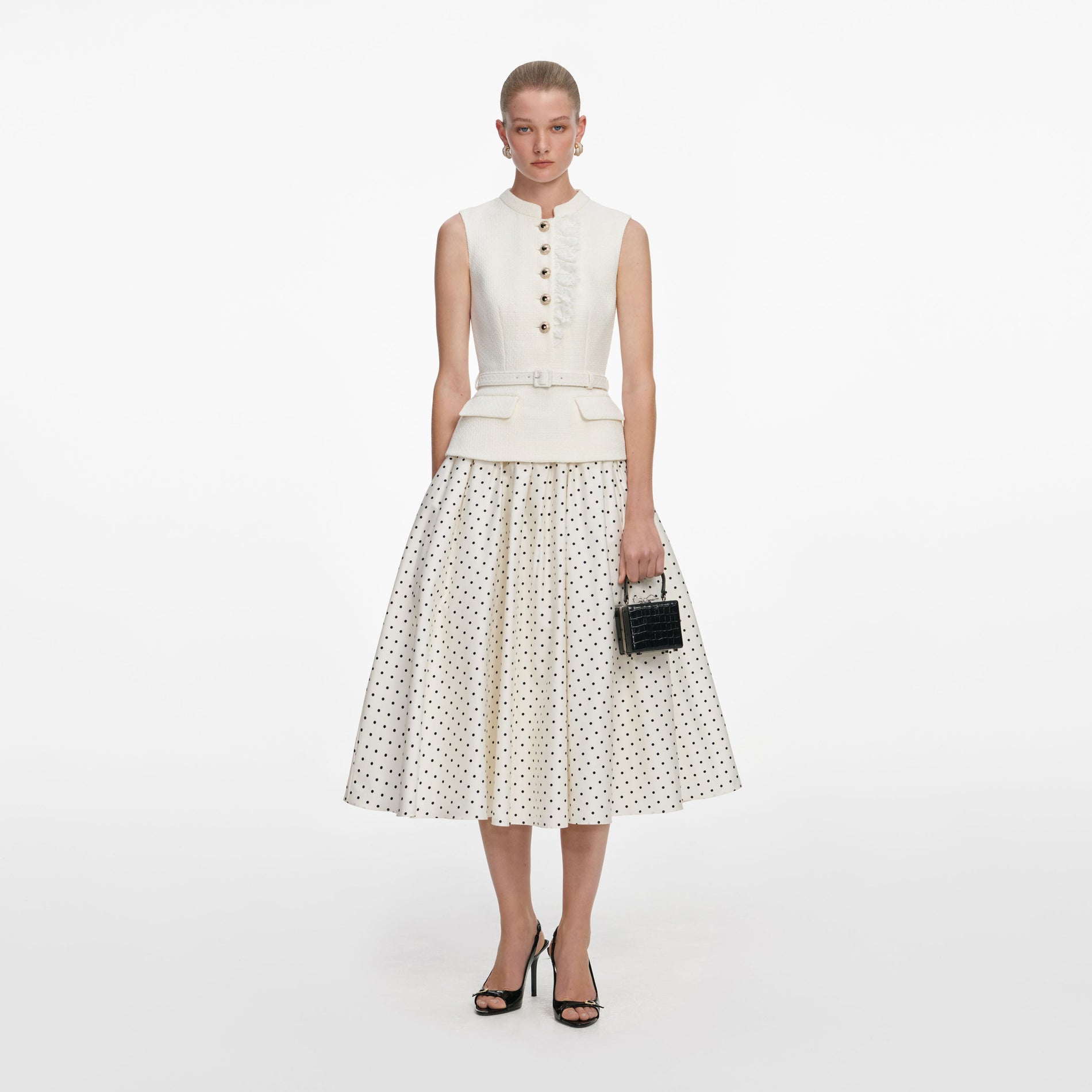 Front view of a woman wearing the Cream Boucle Polka Dot Midi Dress