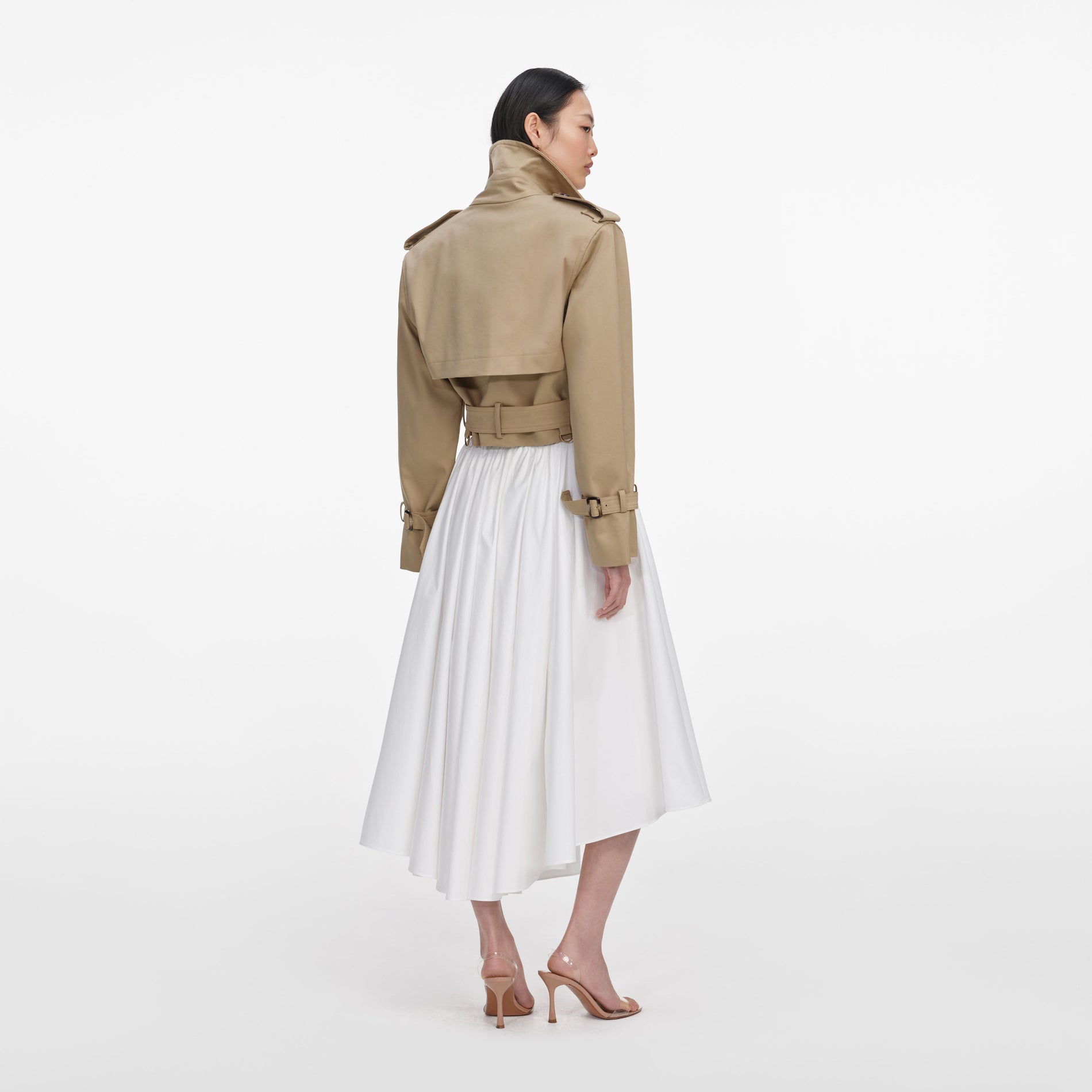 Back view of a woman wearing the Beige Cropped Trench Jacket