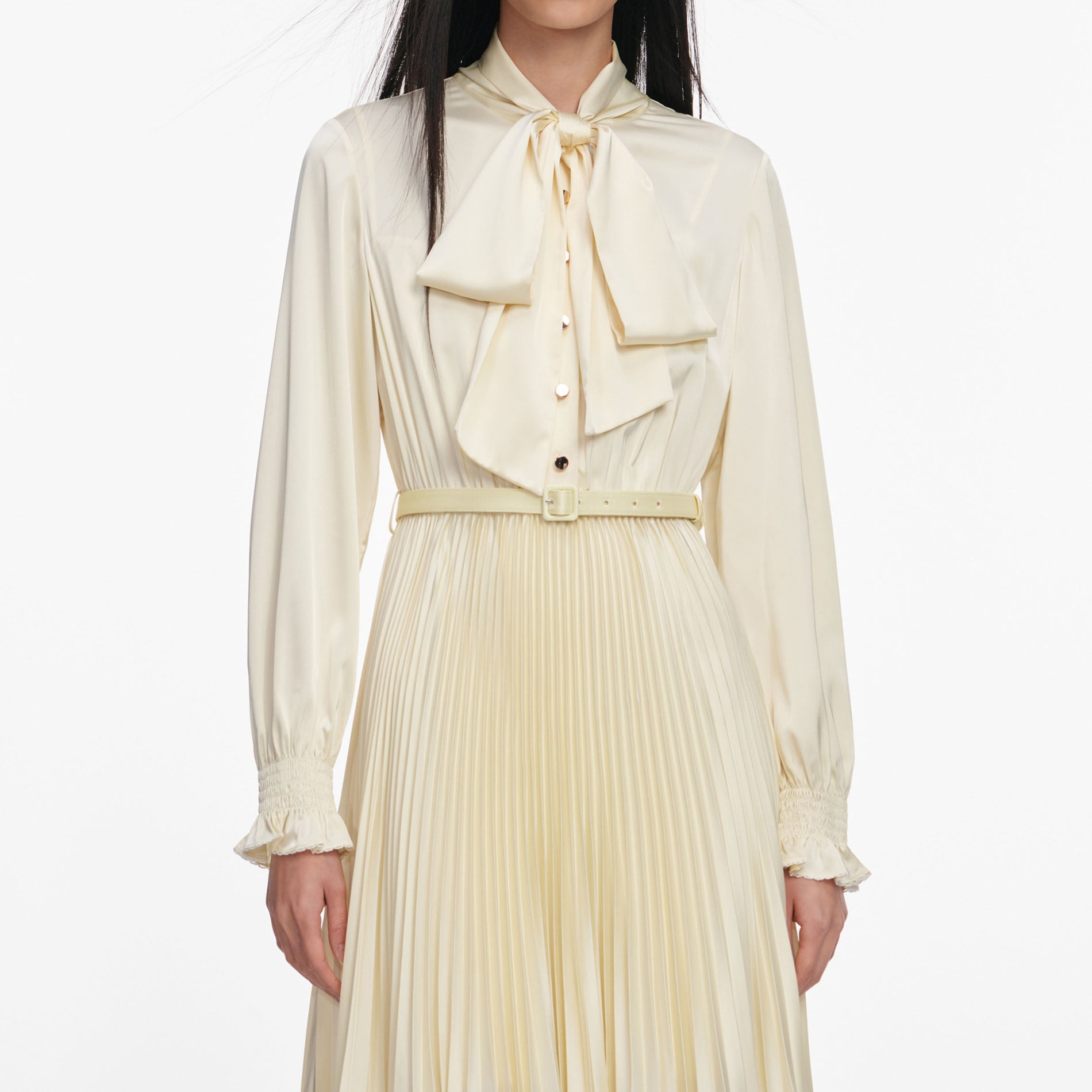 A close up of a woman wearing the Yellow Satin Lace Midi Dress