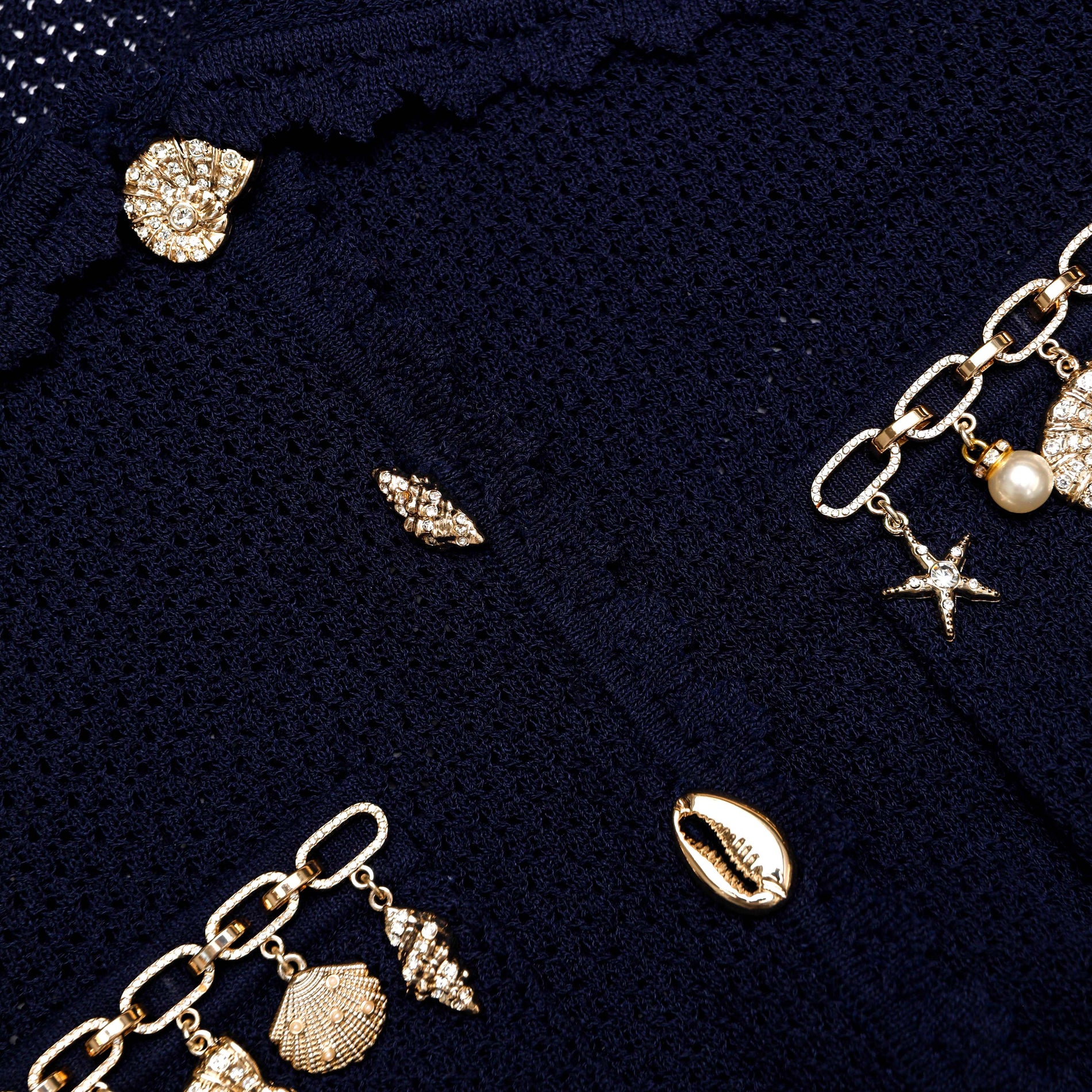 A close up of the fabric for the Navy Shell Embellished Cardigan