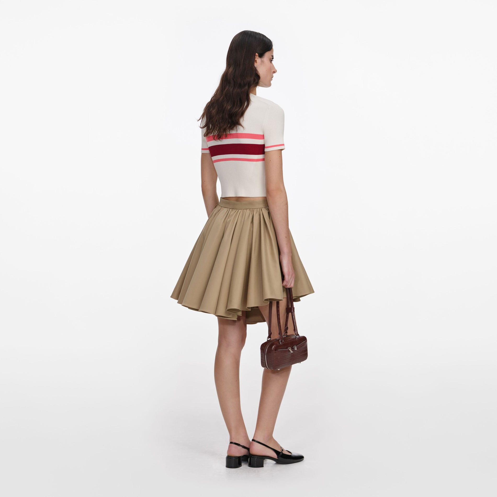 Back view of a woman wearing the Tan Cotton Mini Skirt