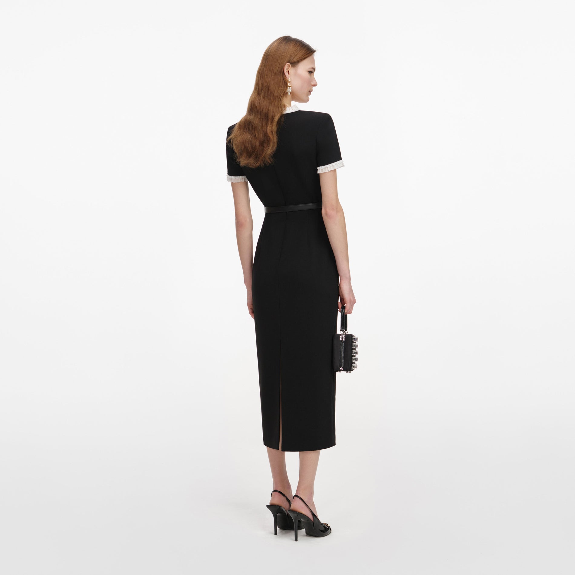 Back view of a woman wearing the Black Crepe Contrast Frill Midi Dress