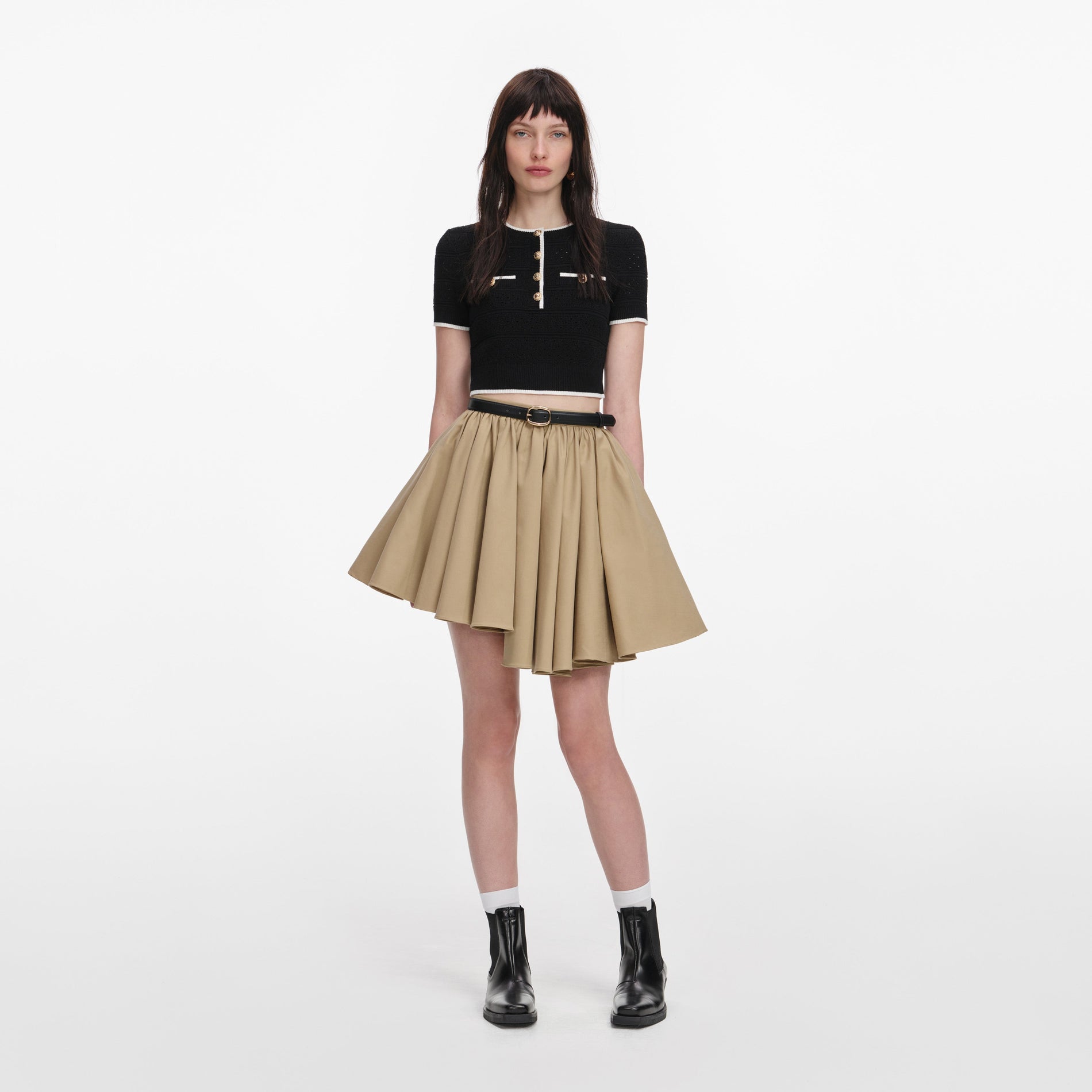 Front view of a woman wearing the Tan Cotton Mini Skirt